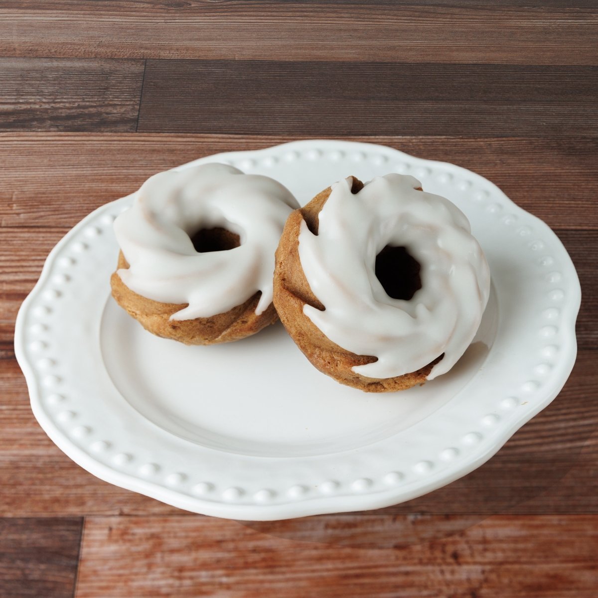 a mini carrot bundt cake with a delectable white glaze