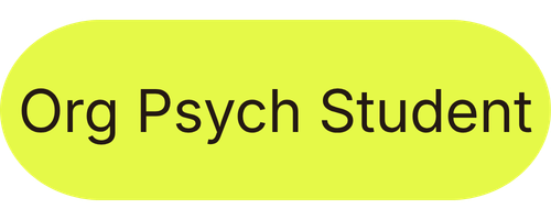 Yellow oval sign with black text reading "Org Psych Student".