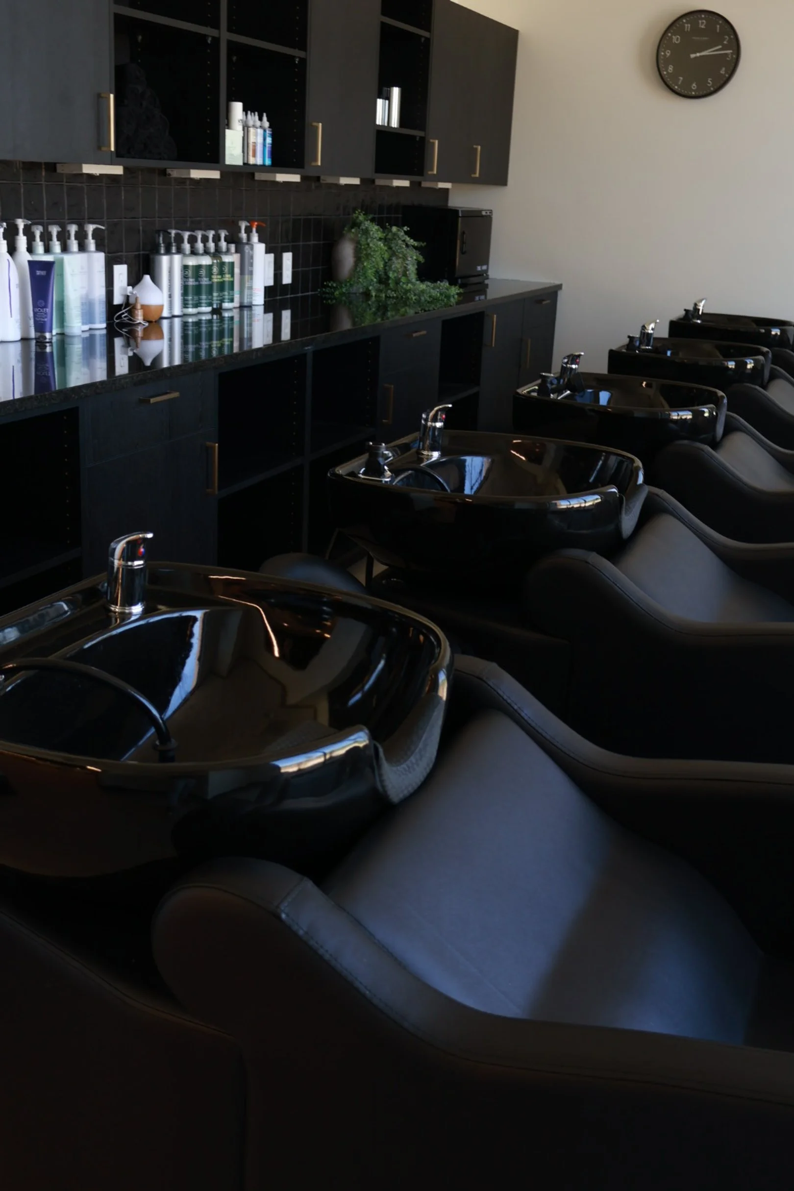 Shampoo and hair treatment area at Mtn + Mane Salon in Timnath, Colorado