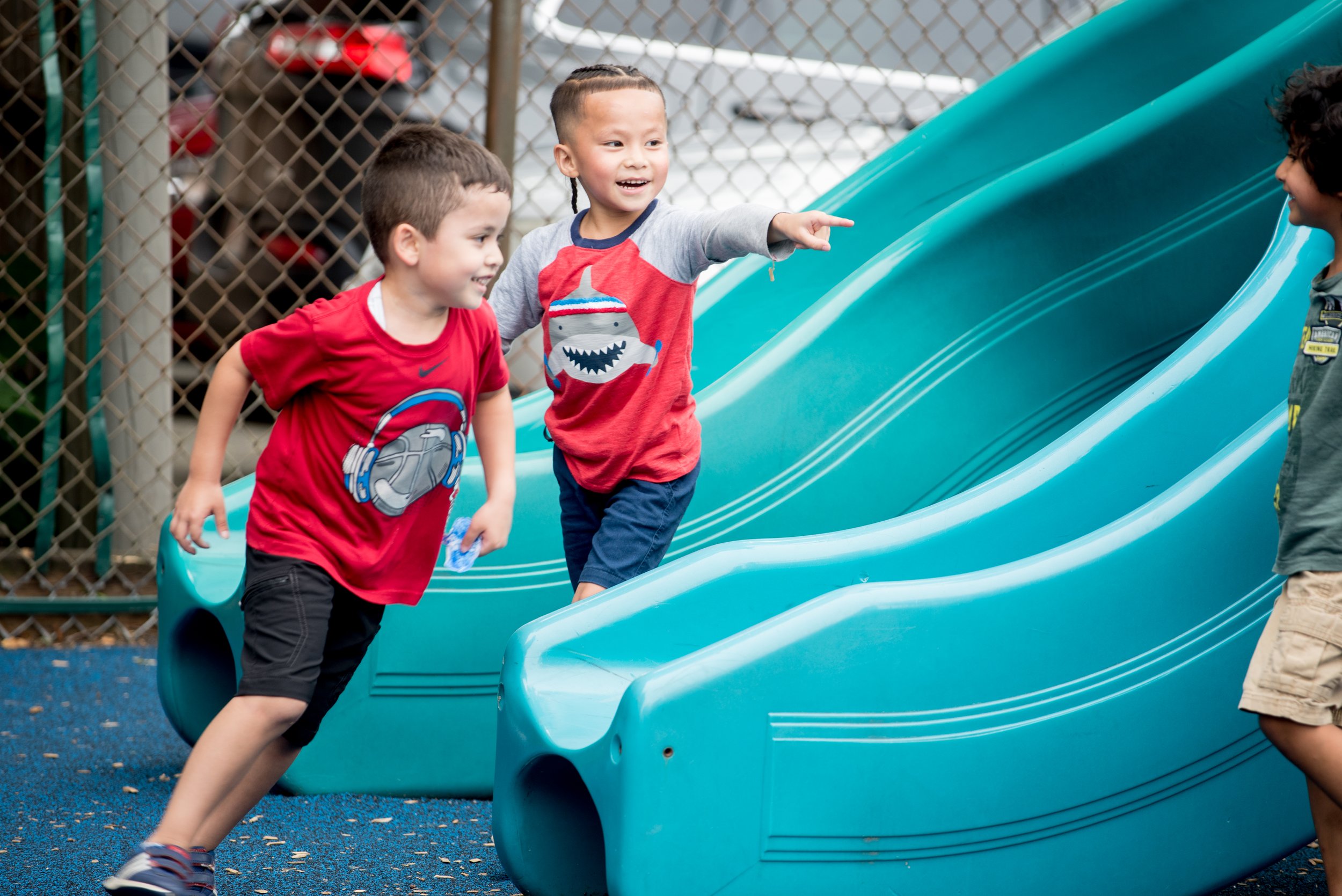 Boys playing outside on slide