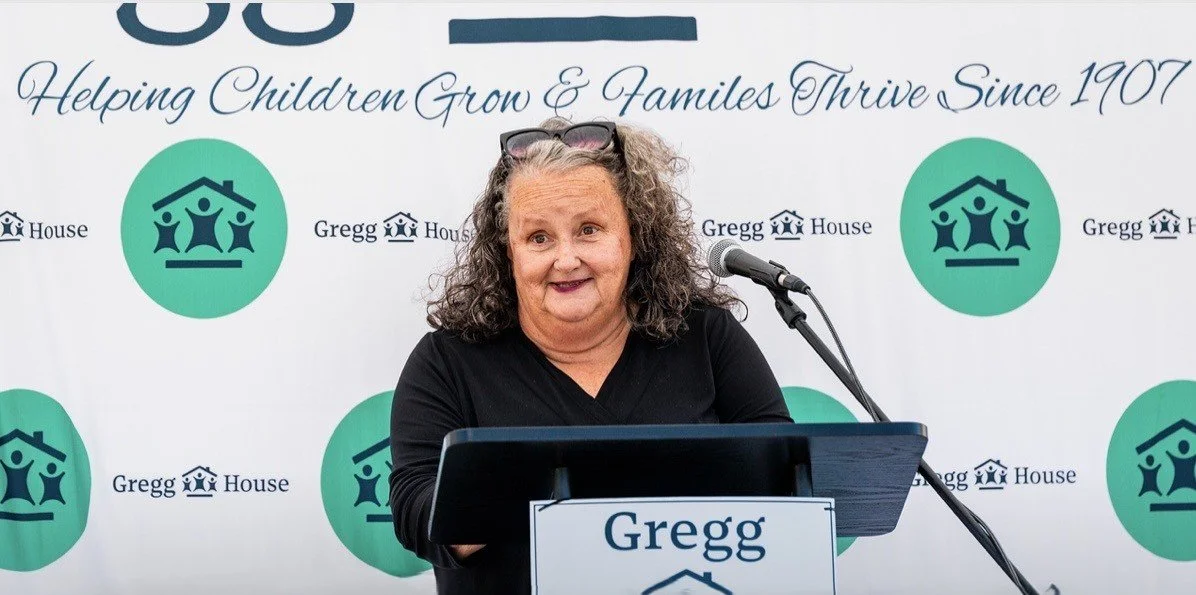 Kelly O'Connor, CEO of Gregg House speaking at the podium