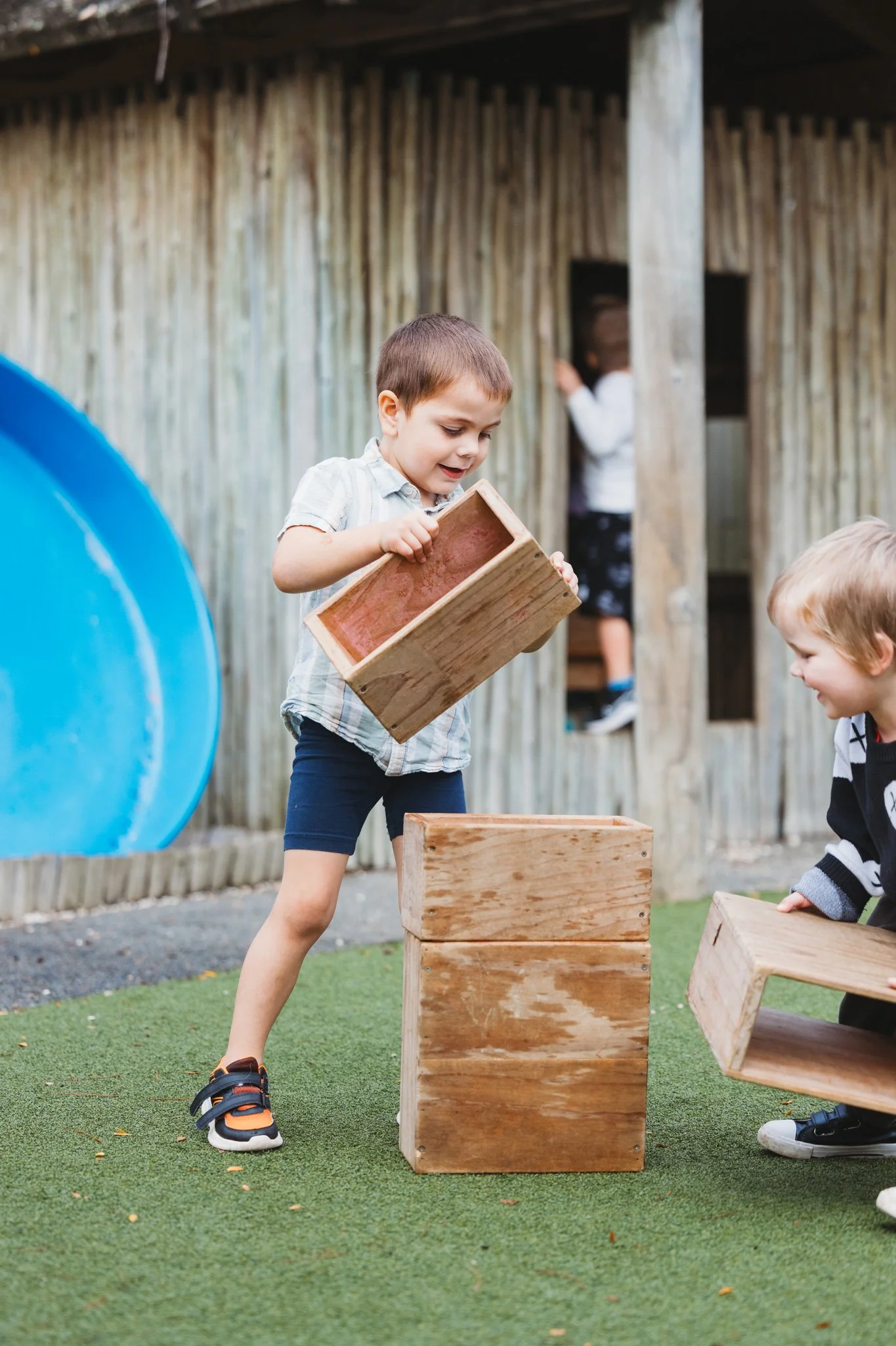 Boys playing outside and having fun at Mangere childcare