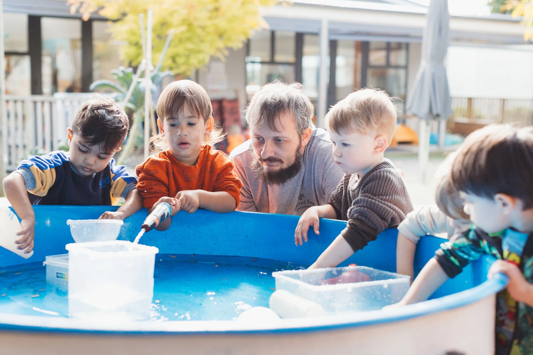 Water play with their teacher  at Mangere childcare
