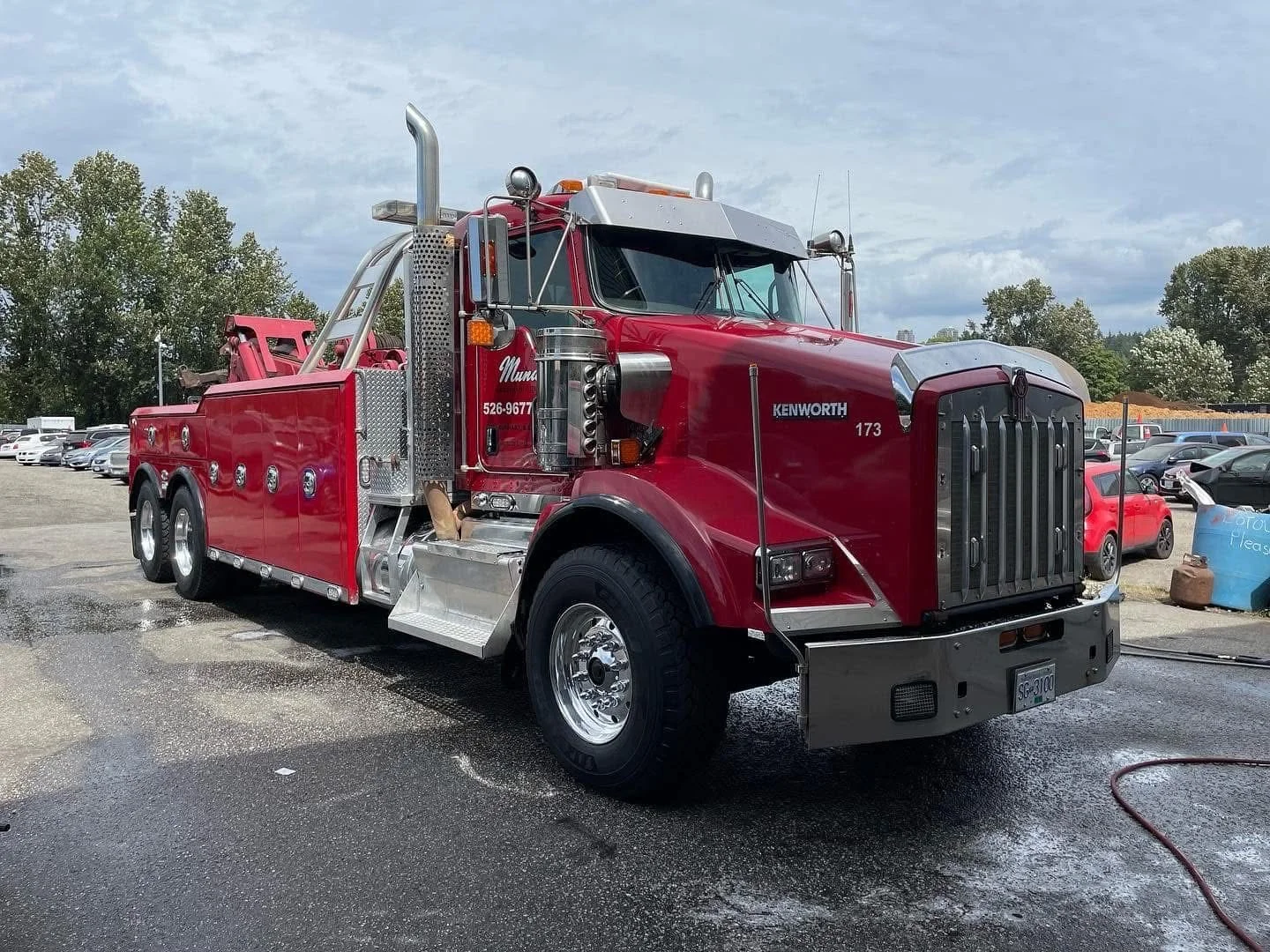 Red Peterbilt tow truck with polished chrome and paint protection