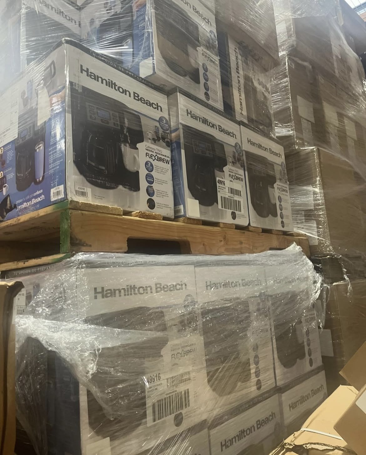 stacked boxes of Hamilton Beach coffee makers wrapped in plastic on pallets