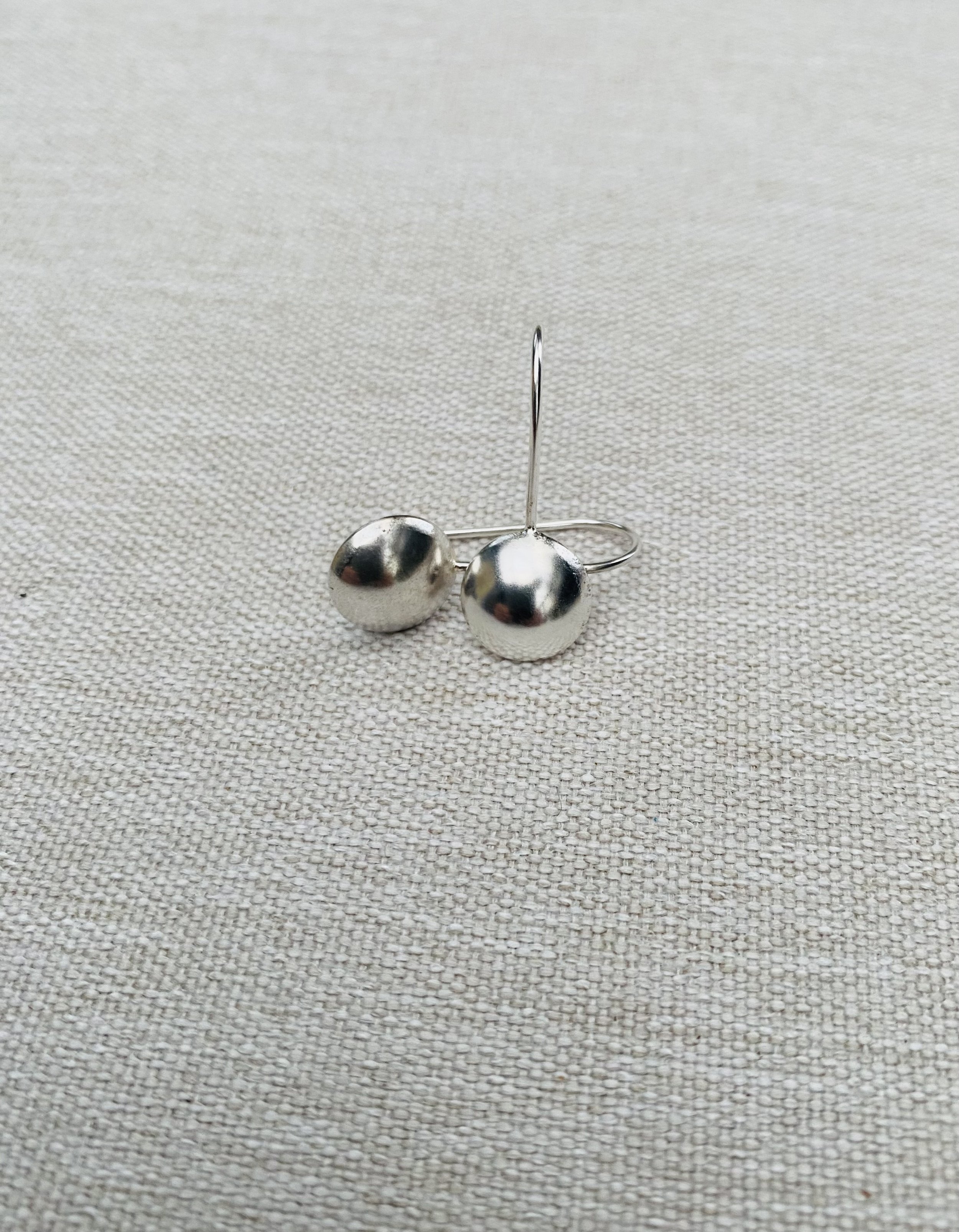 Domed silver earrings Cute as a Button.jpg