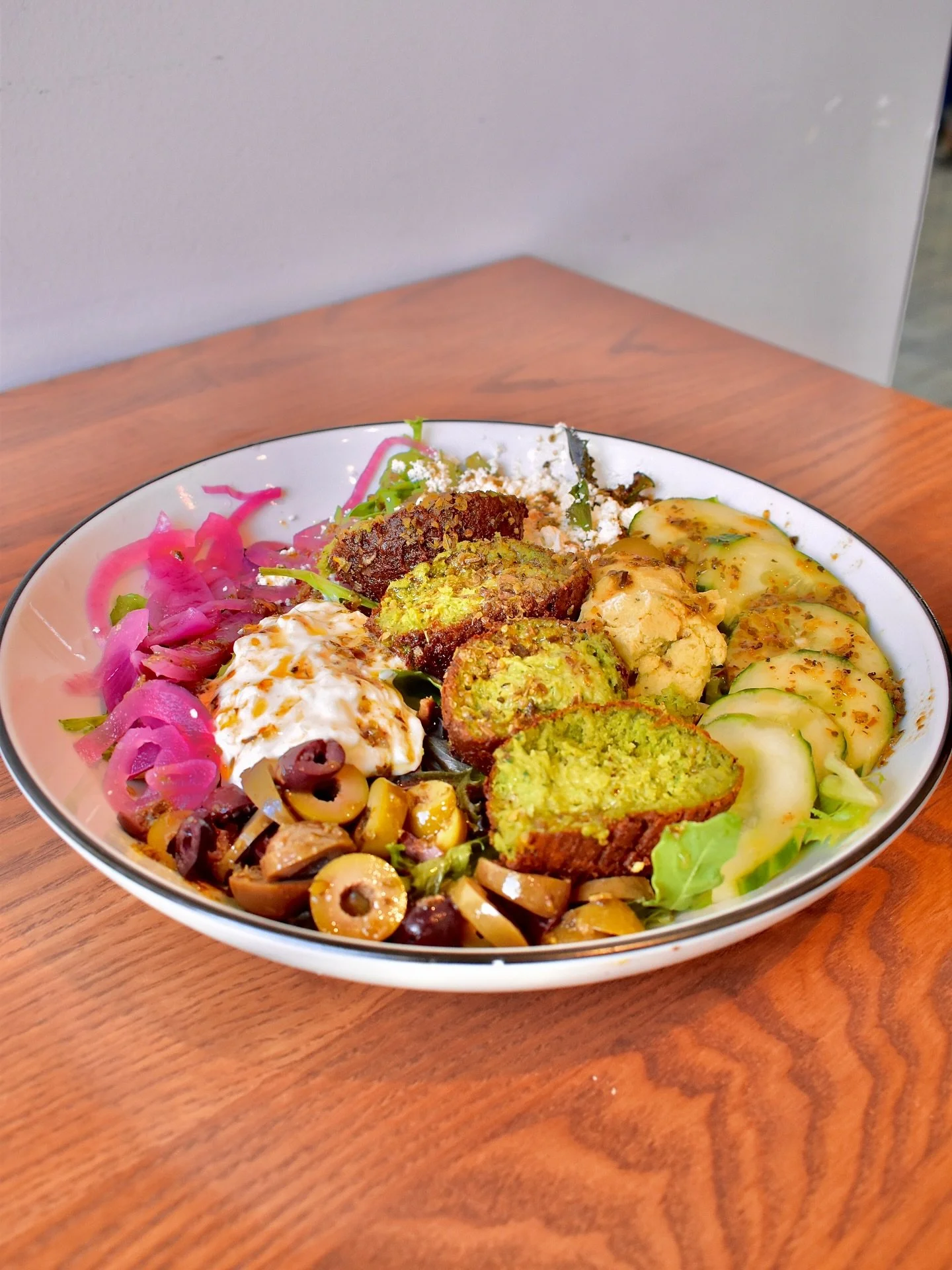 &ldquo;One of the best things I&rsquo;ve had in a while.&rdquo;

Straight from a customer&rsquo;s mouth.

Our Mediterranean Bowl is now on the everyday lunch + dinner menu with mixed greens, cucumbers, feta, olive medley, falafel, pickled red onions,
