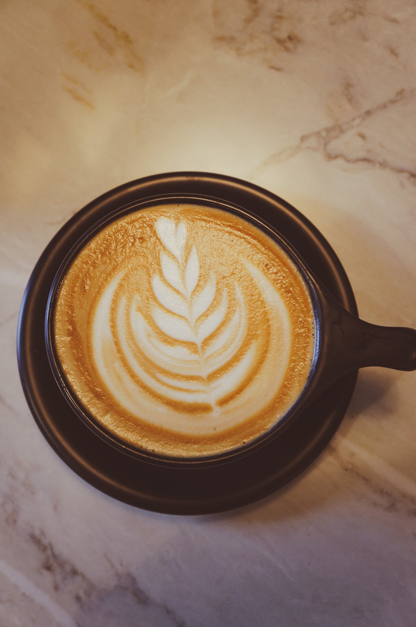 Latte art from Lake Roots Cafe