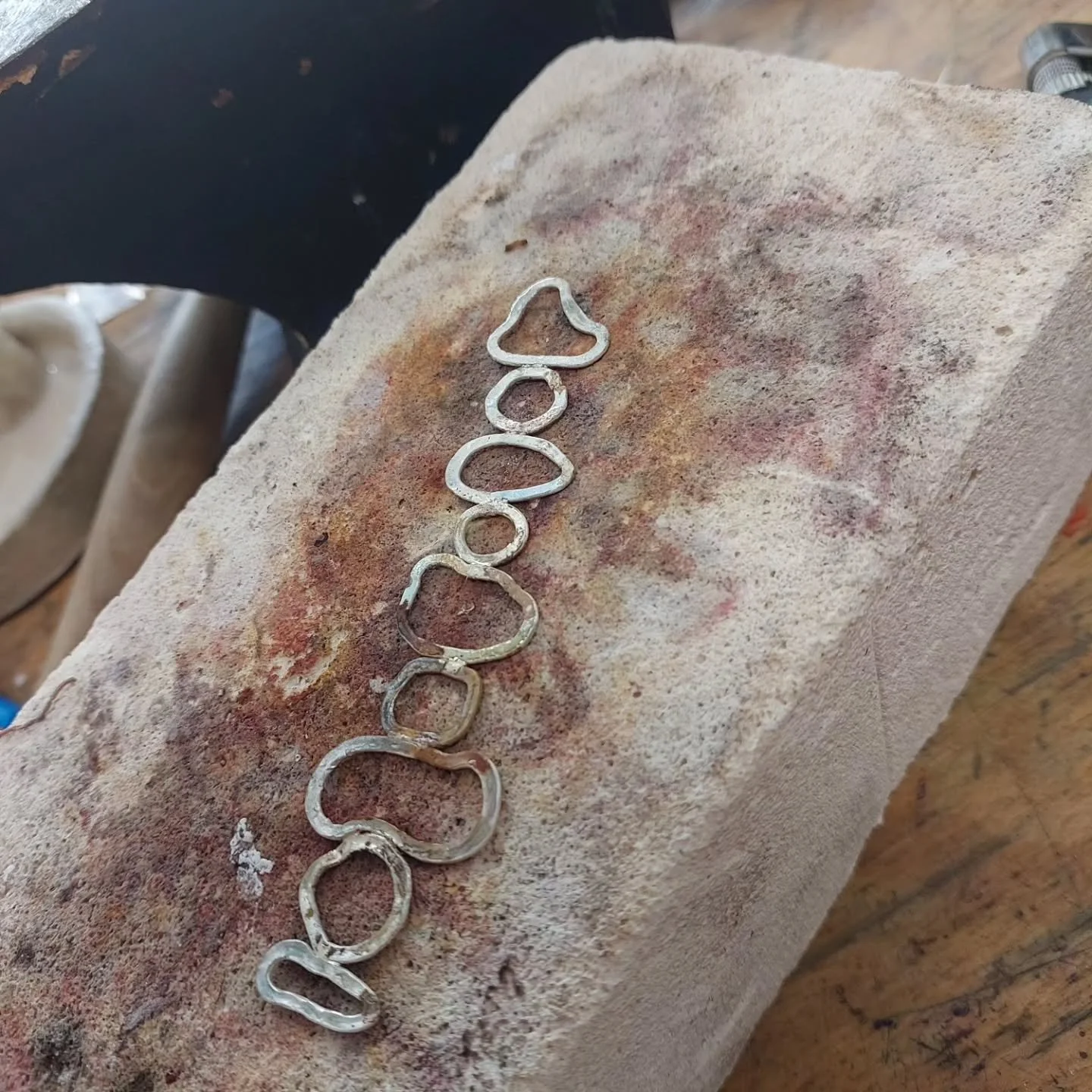 Work in progress. I have been away from the bench for what seems like weeks, next week I will have some time to complete customs and keep playing with this concept. Its all made with silver from my scrap box - can you see what its becoming?