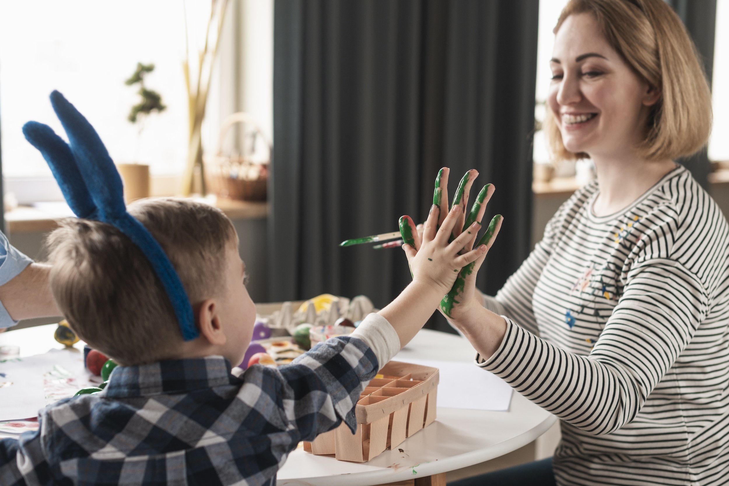 Moving Mountains Village_OT and Behavioural Therapy Sydney_happy-mother-painting-sons-hands-easter.jpg