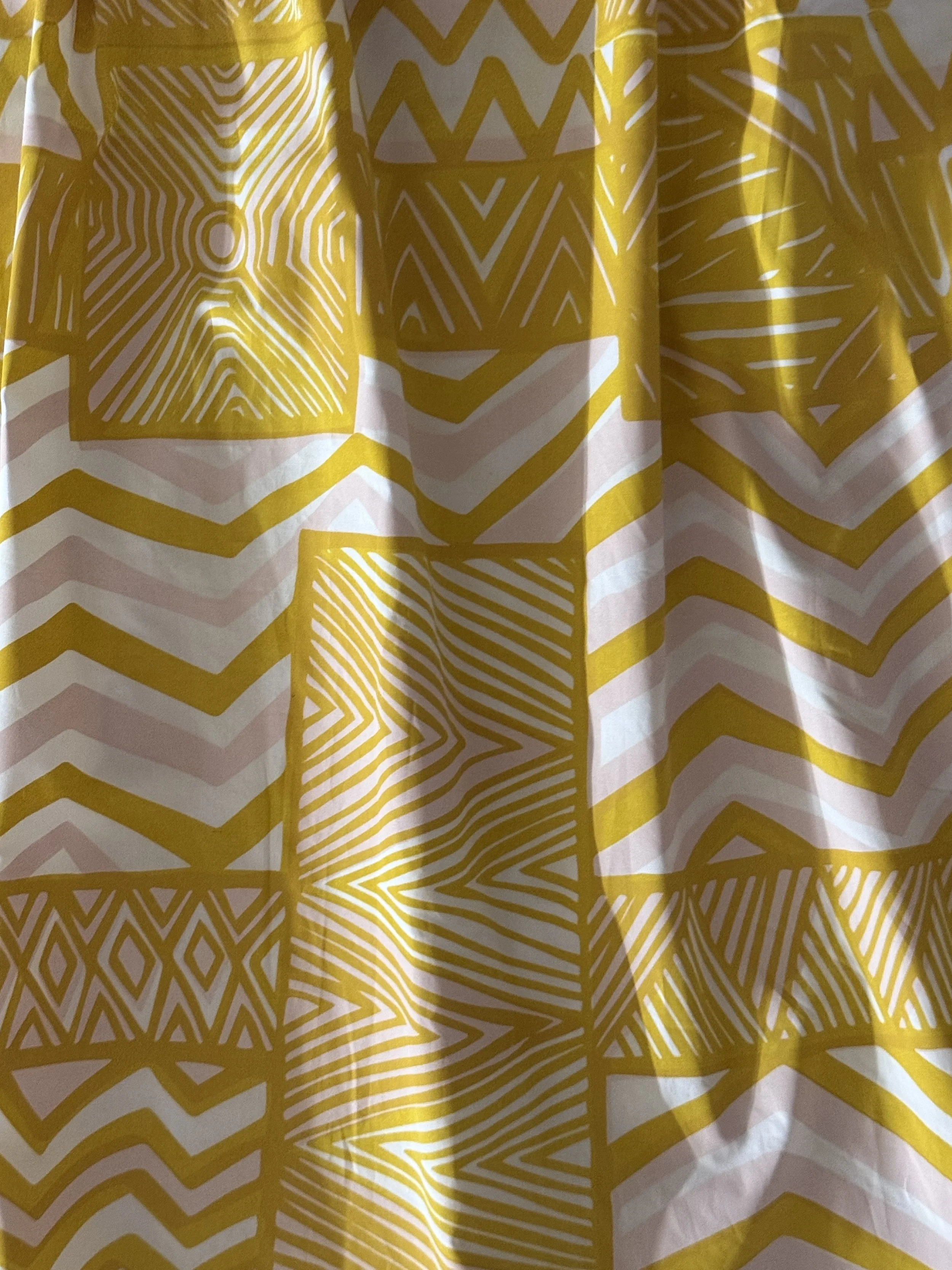 Poplin skirt detail Pukamani print in yellwo and pink.jpg