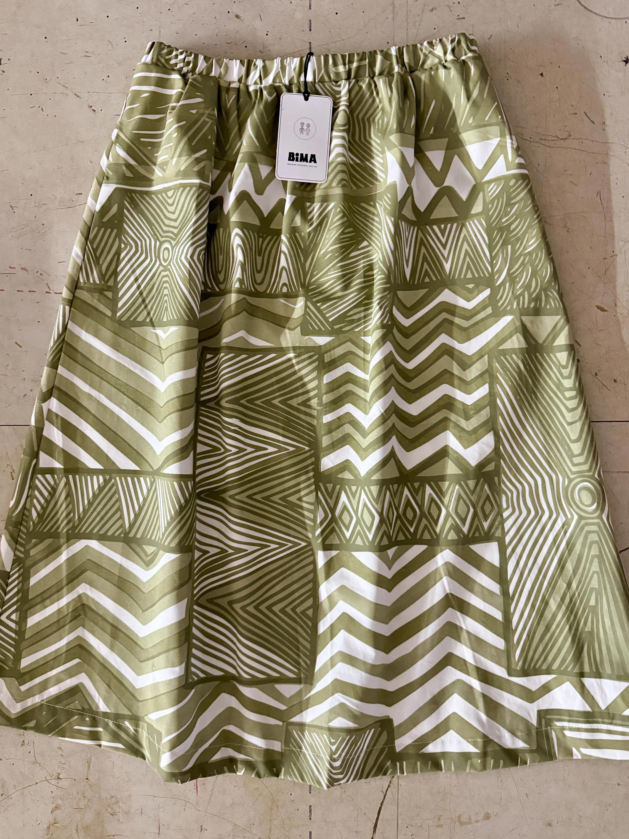 Cotton poplin skirt with green pukamani print.jpg