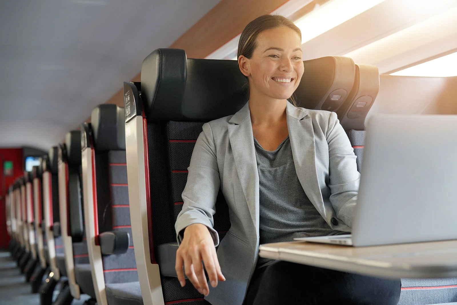 Female Business Traveller On Train
