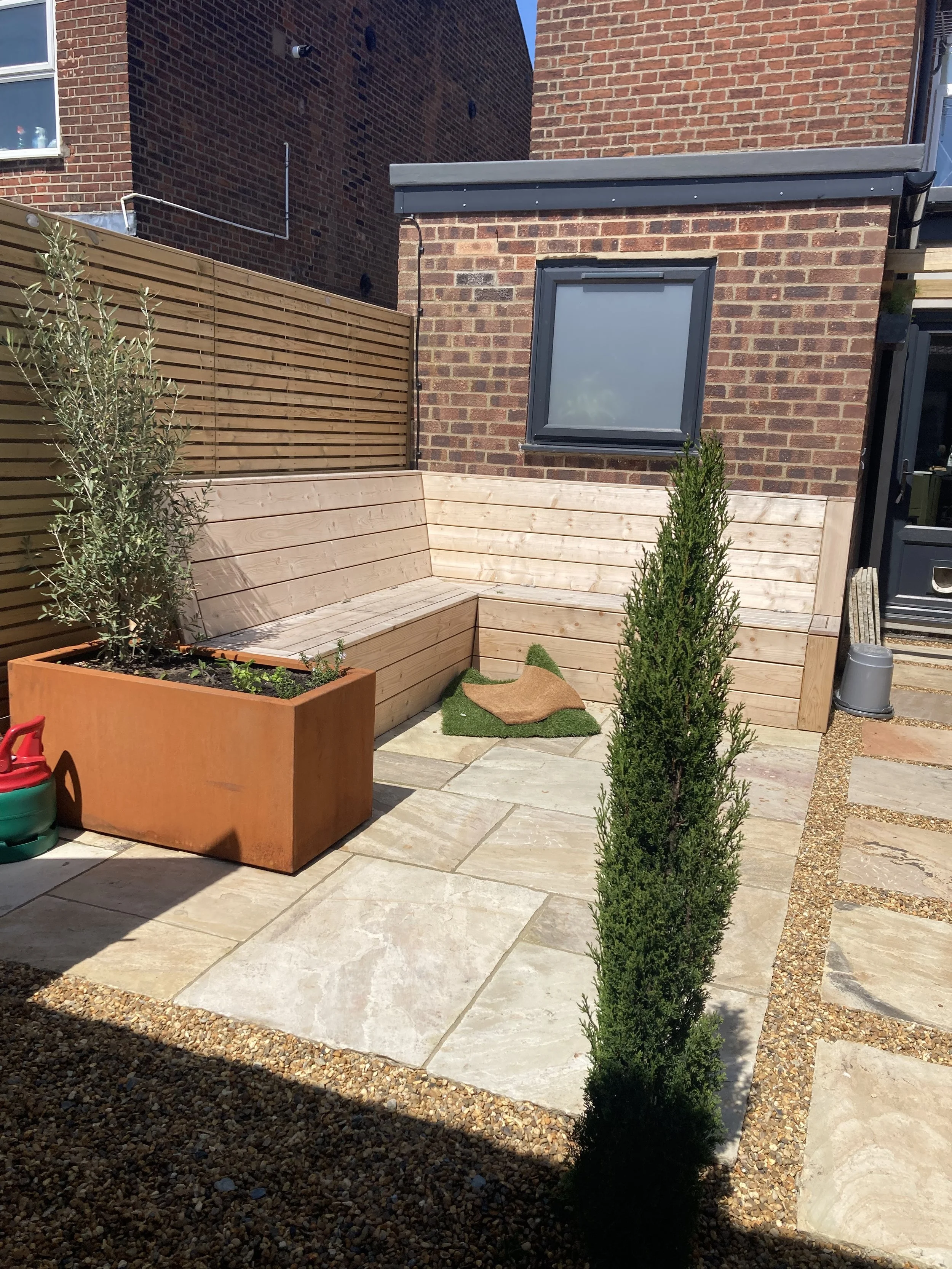 Bespoke Seating and Sandstone Patio for this Small Garden in Norwich, Norfolk