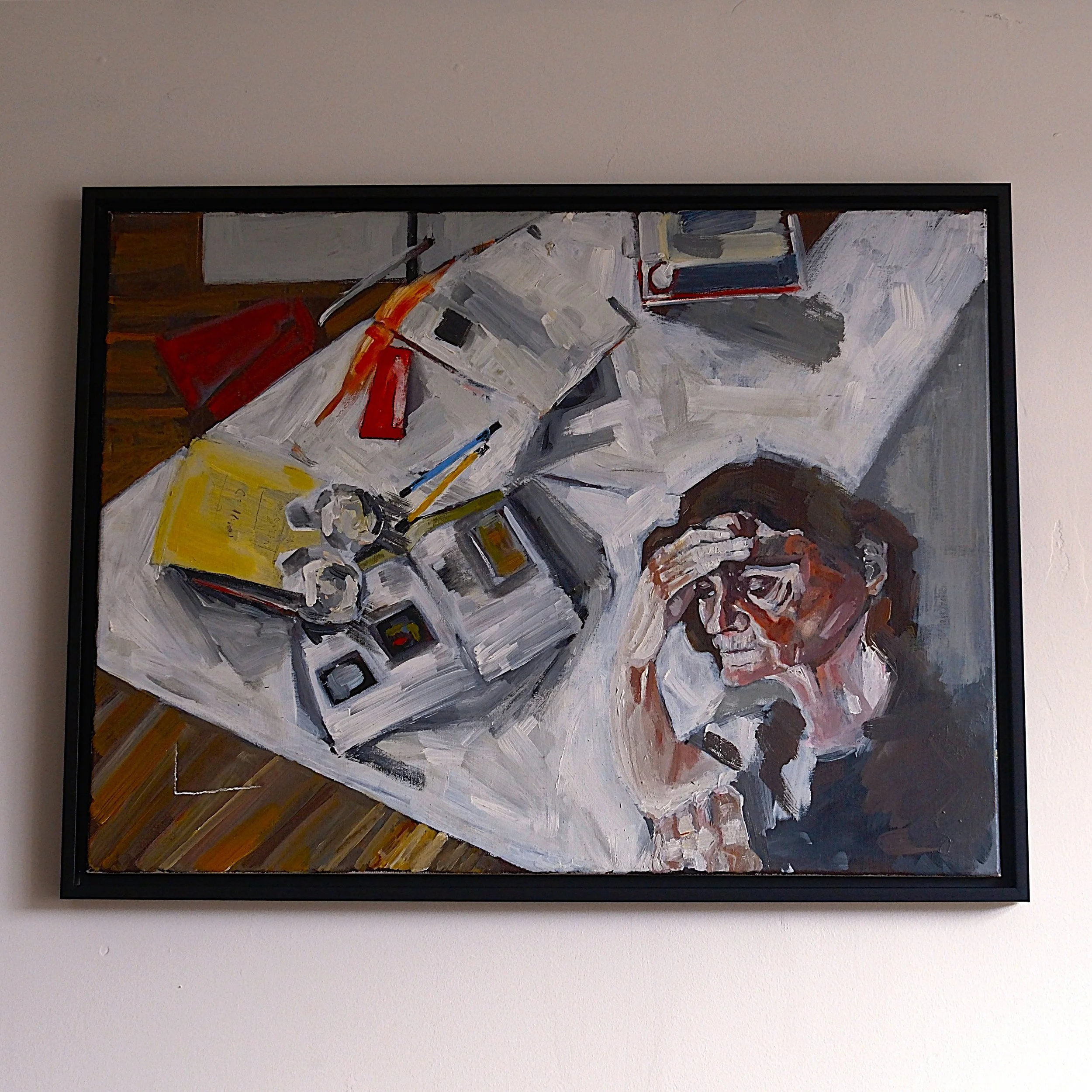 An abstract painting of a cluttered desk with various electronic devices, papers, and a person resting their head in one hand.