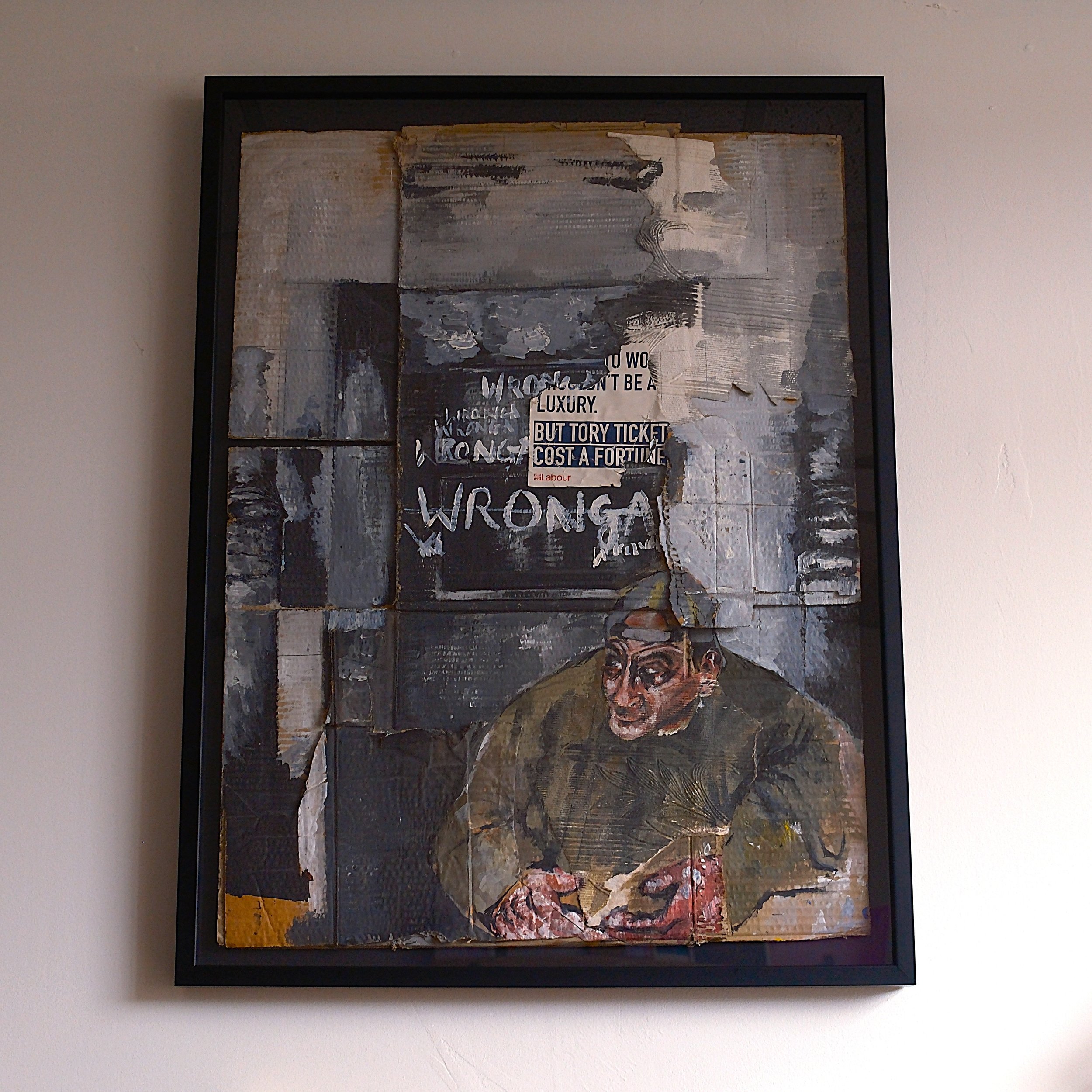 A mixed media artwork featuring a man with a serious expression, known as 'Worried Man,' with layered textures and torn sections. There is a blackboard with white writing behind him, discussing the cost of Tories and a critique of luxury and fortune.