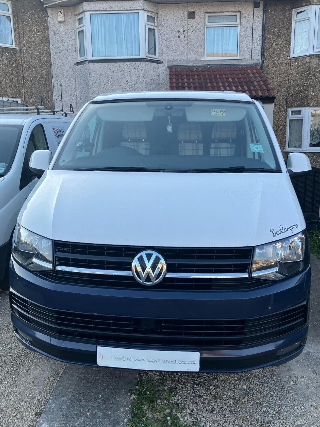 White Volkswagen T6 2.0TDI campervan with blue accents