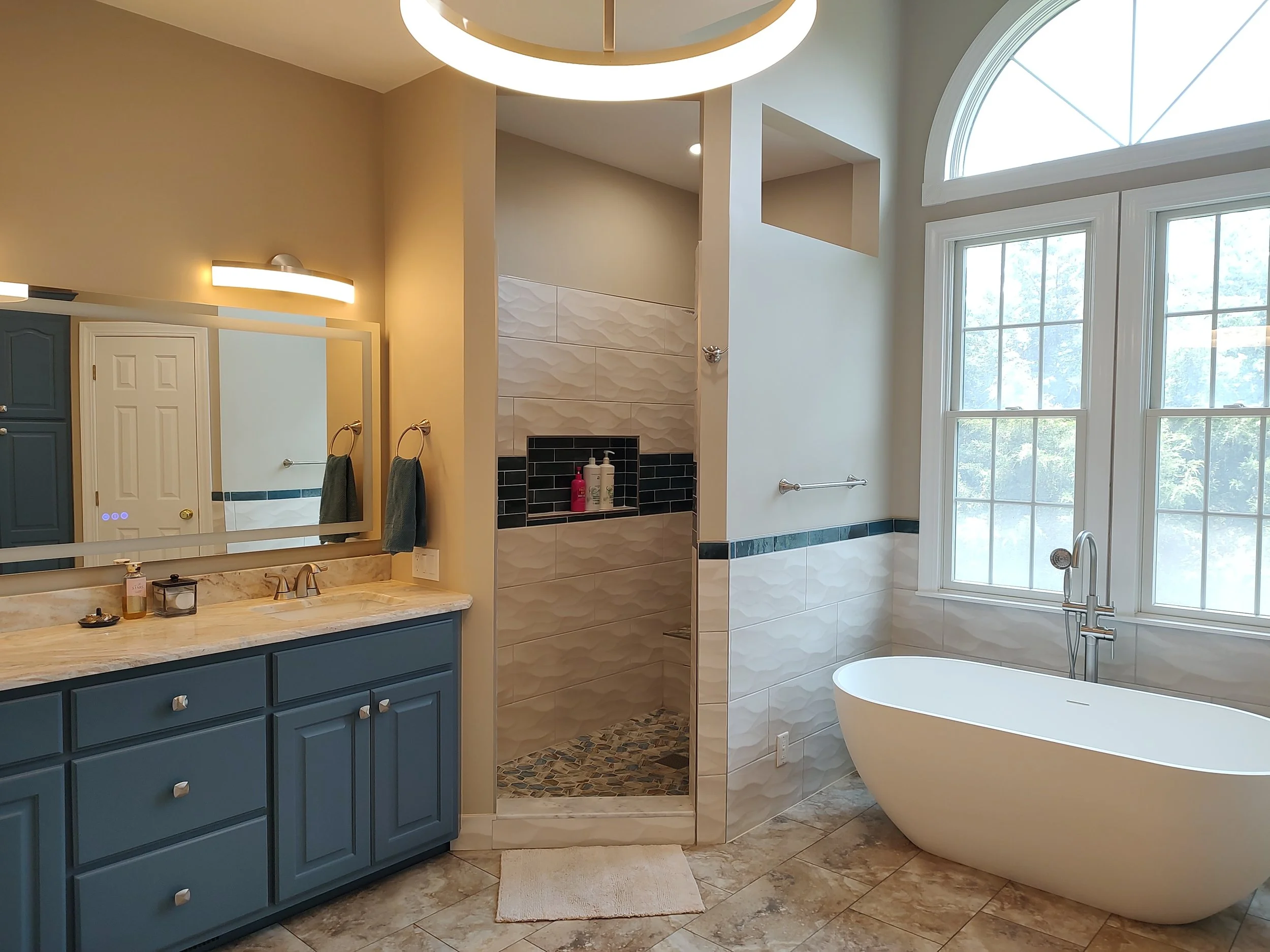 Master bathroom with tub and walk-in shower in Riner, VA