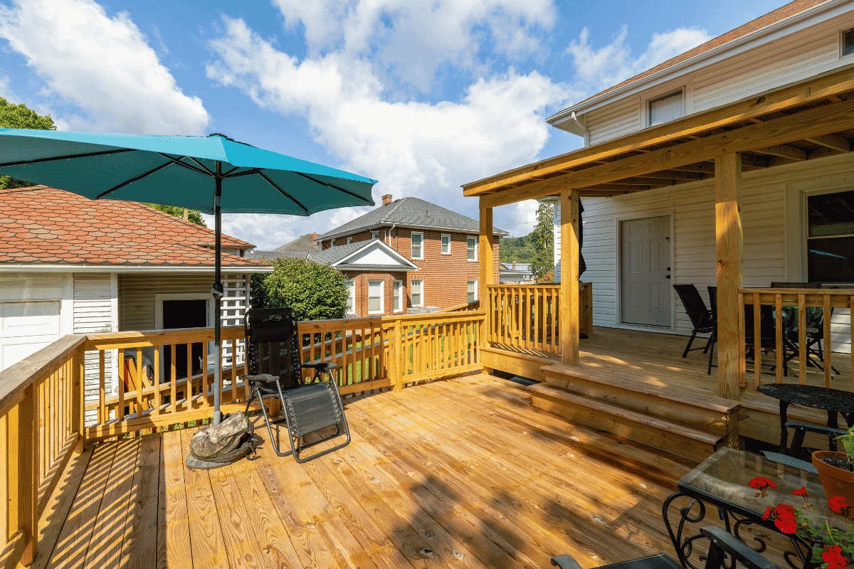 Two-level back deck addition on a 1919 Sears kit house in Pembroke, Virginia, with a covered upper level and open lower level.