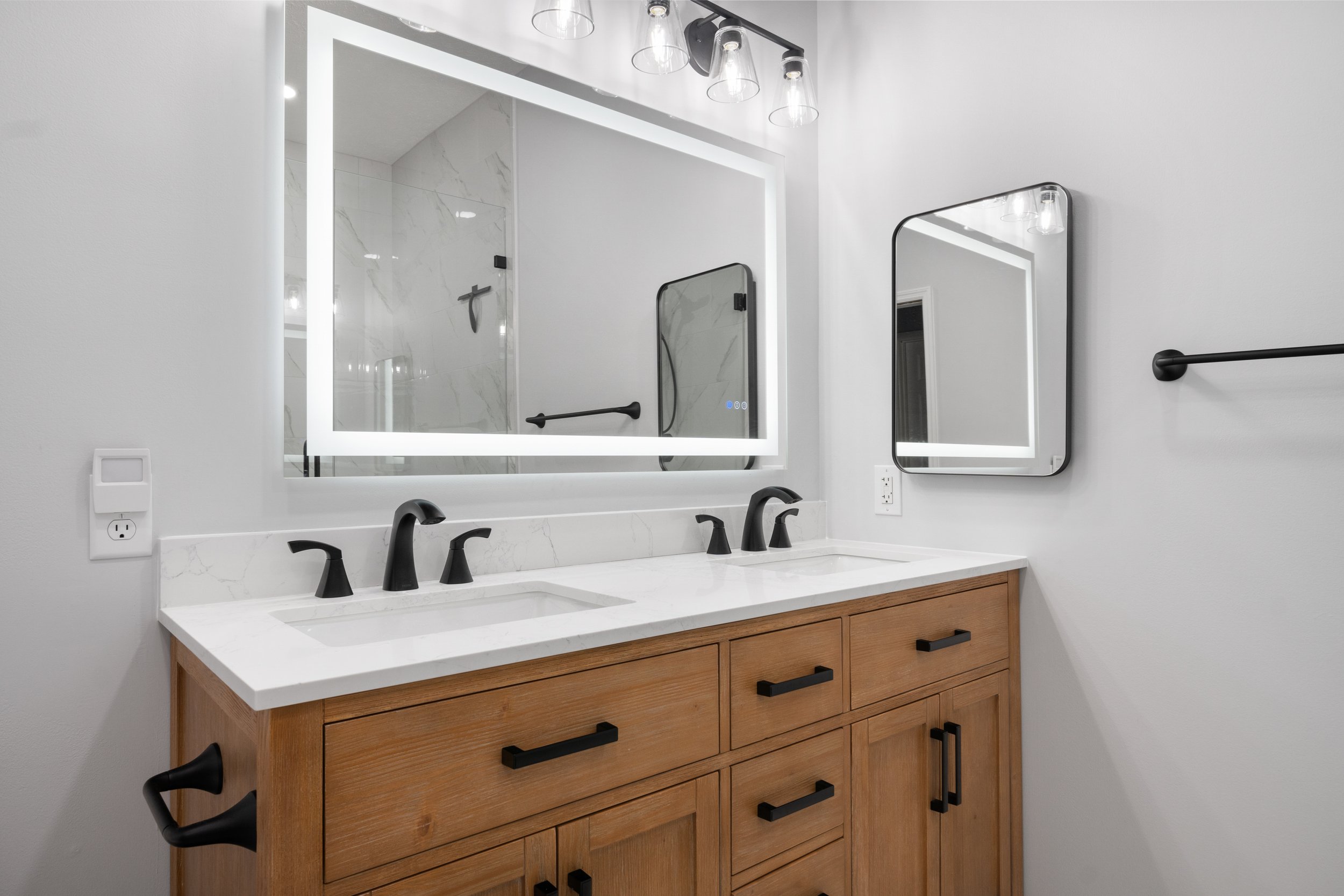 Primary bathroom renovation in Christiansburg, Virginia with an updated shower, vanity and modern finishes