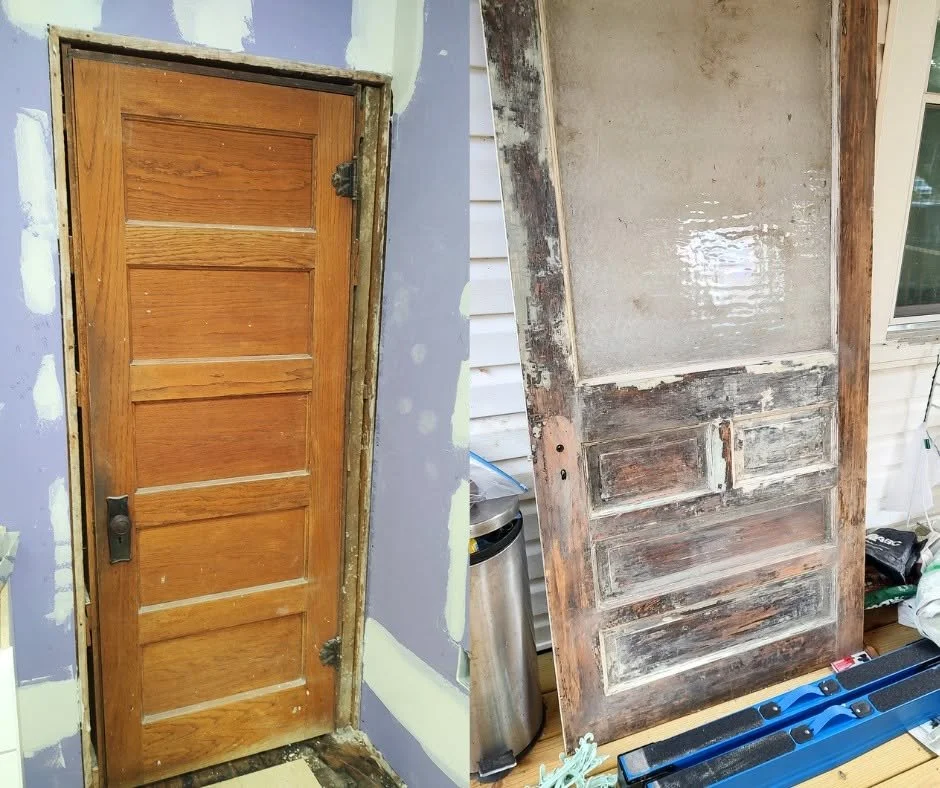 Original wood basement door preserved in the kitchen of a 1919 Sears kit house in Pembroke, Virginia.