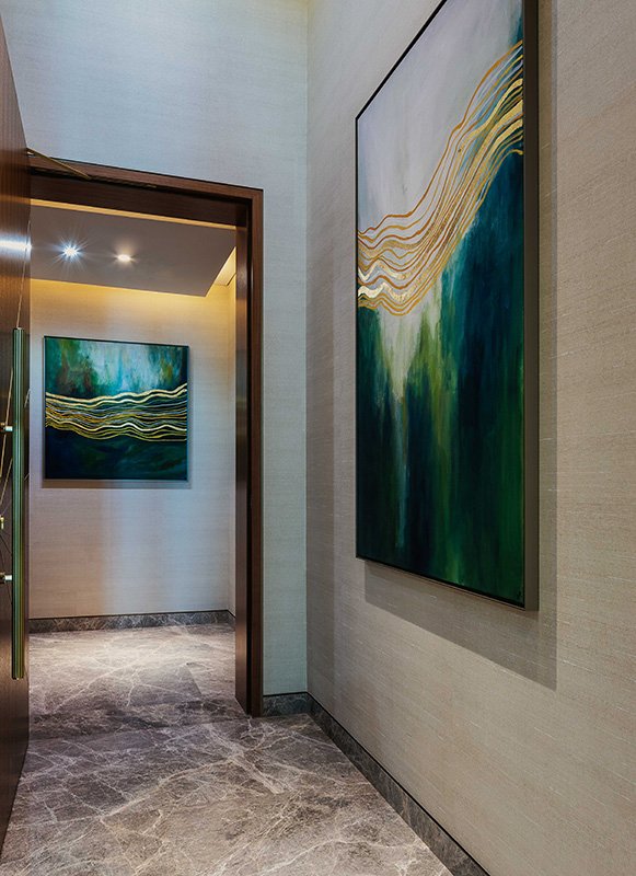 Contemporary hallway Burj Al Arab with abstract paintings; marble floor; soft lighting; modern interior design.