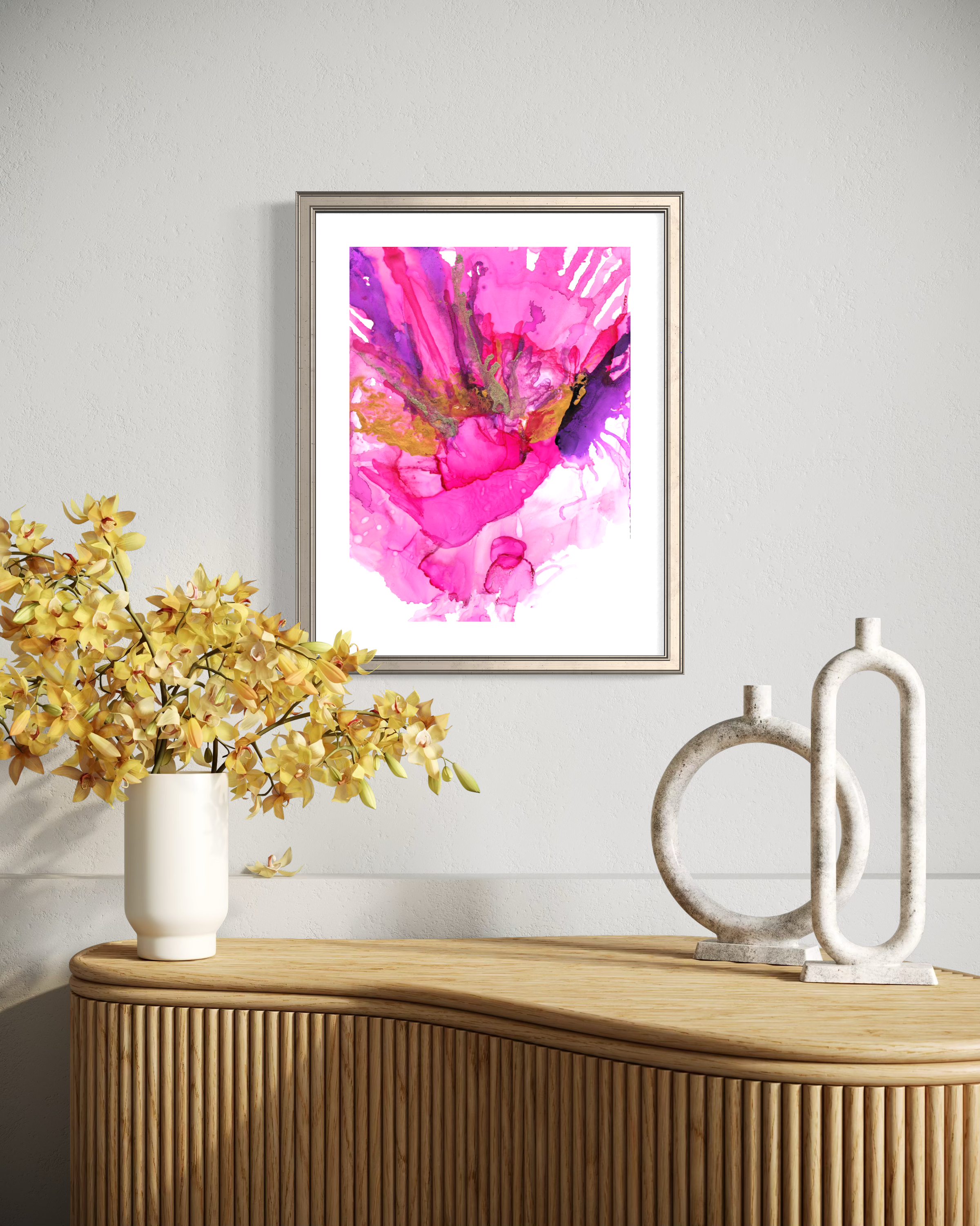 Pink Splash abstract pink art print by Louise Duggan displayed framed above a sideboard.
