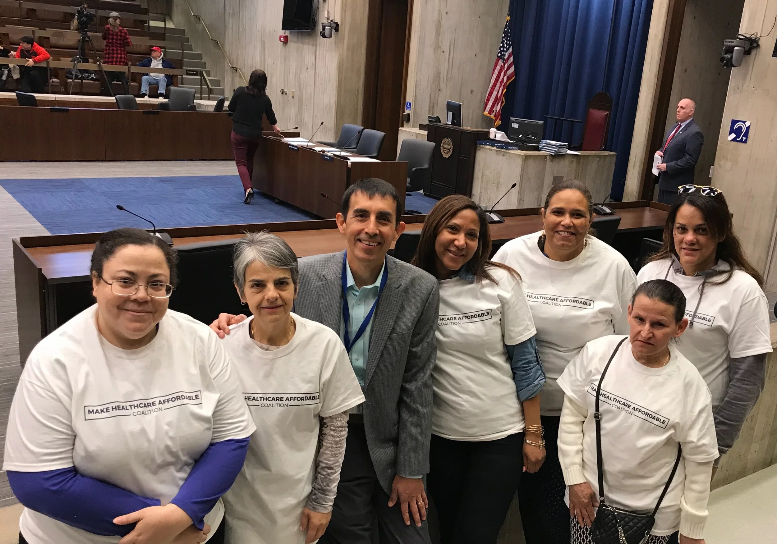 Samuel Hurtado and group of activists for 'Make Healthcare Affordable Coalition,' posing together at the MA State House.
