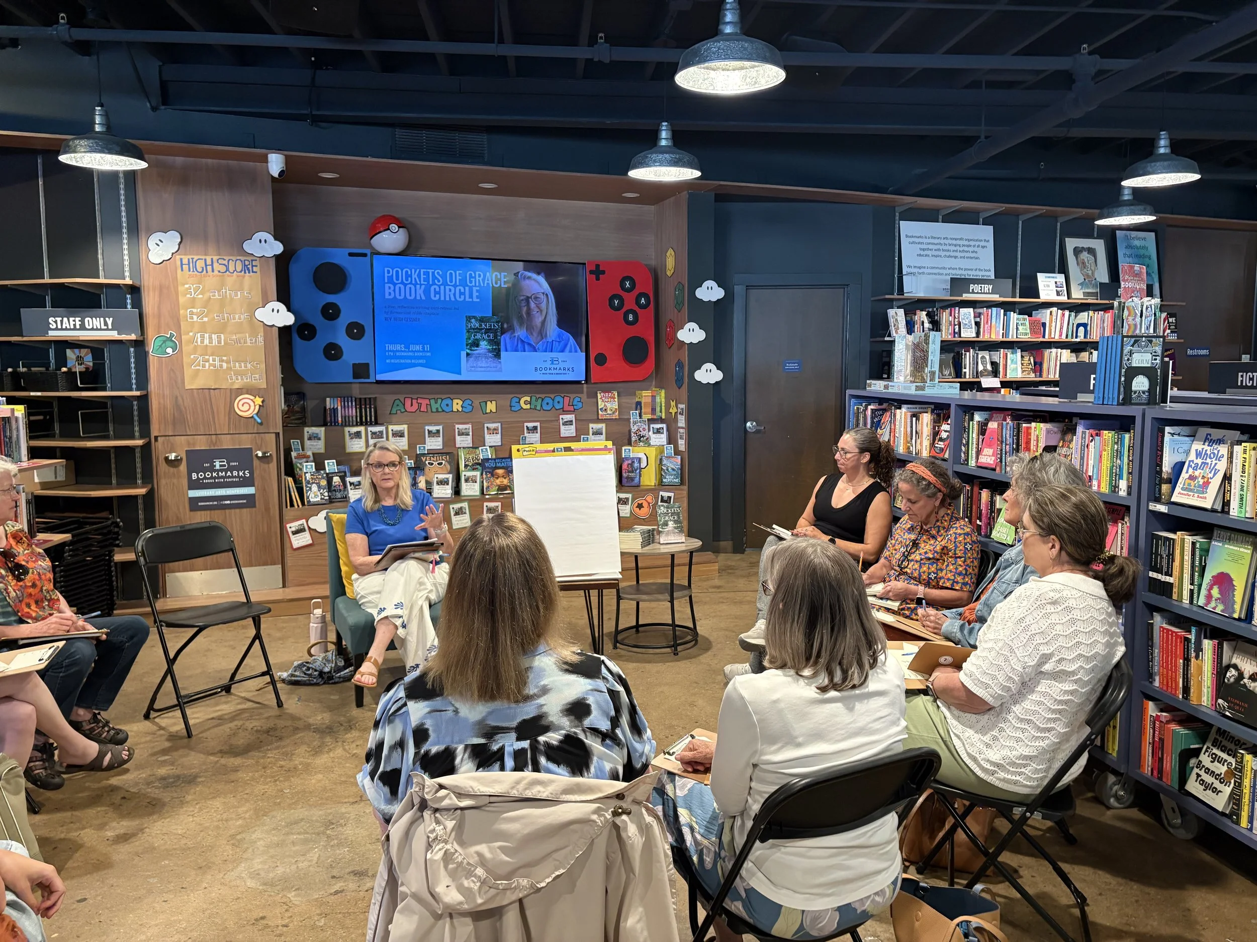 Heidi Gessner sits among a circle of women writing together at a Pockets of Grace gathering.