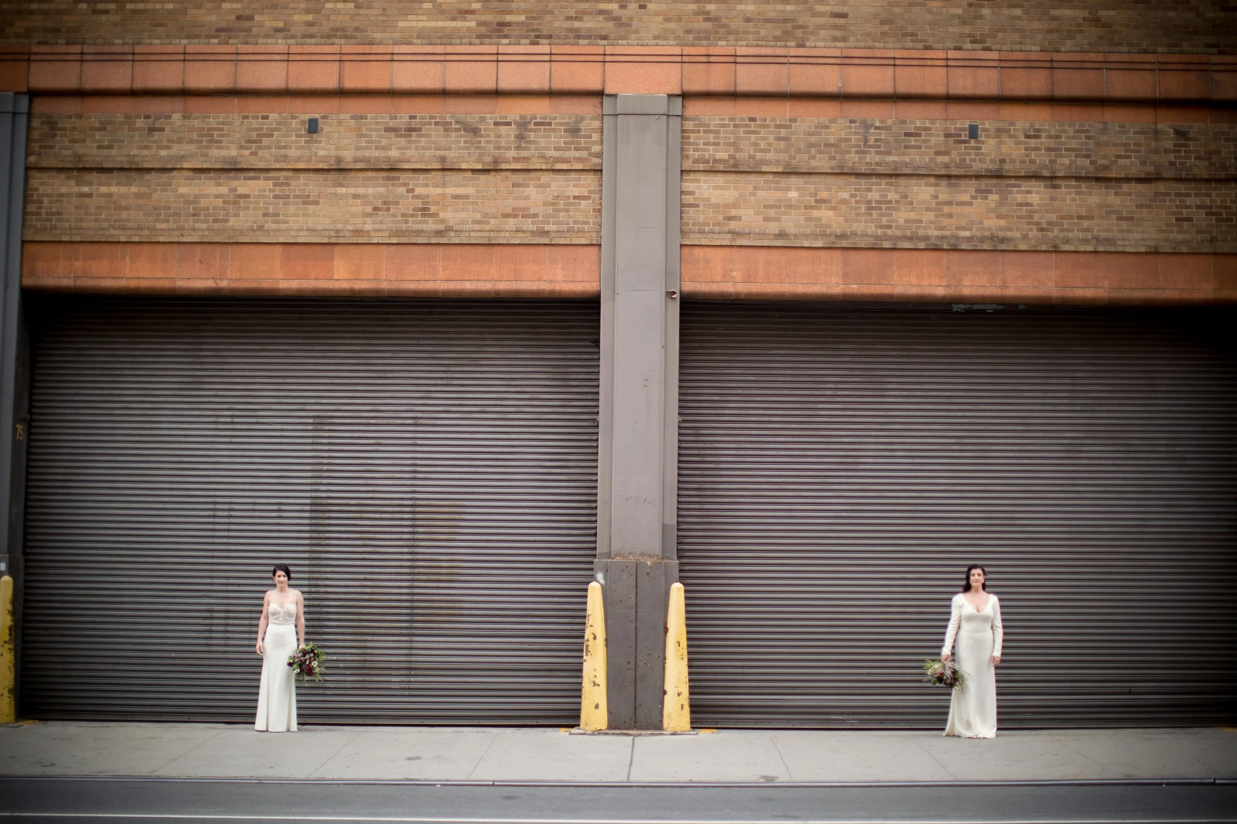 Two women in white wedding dresses in New York City, representing LGBTQ+ relationships and affirming therapy support