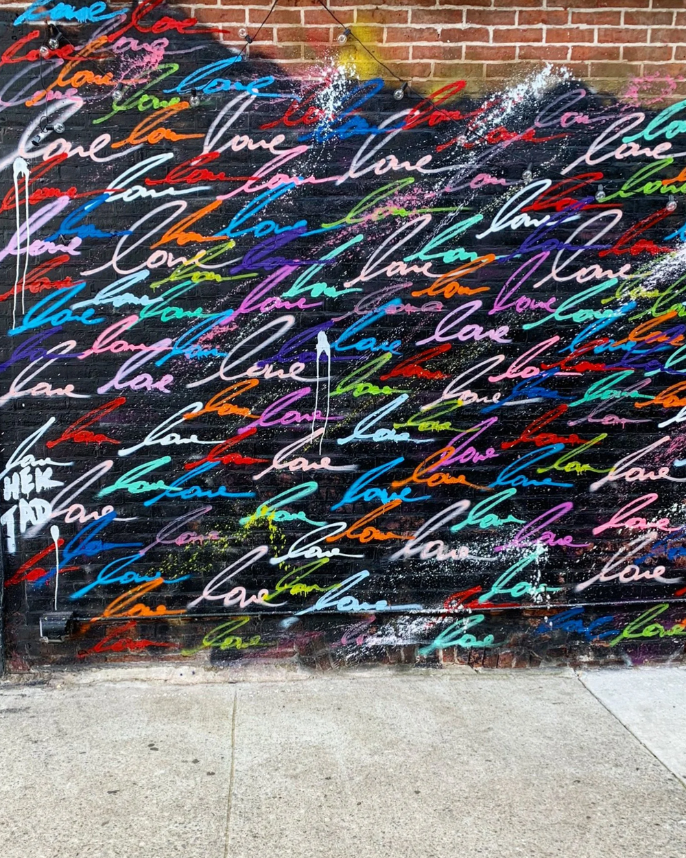 Colorful graffiti wall with painted hearts symbolizing love and connection