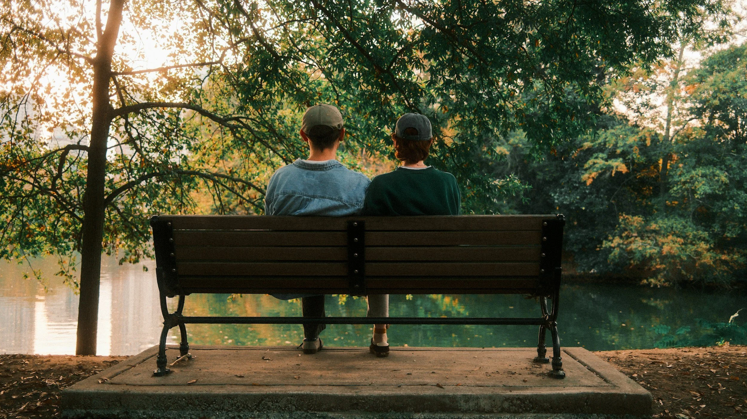 Couple sitting together in a reflective conversation representing emotional intimacy and healthy relationship connection
