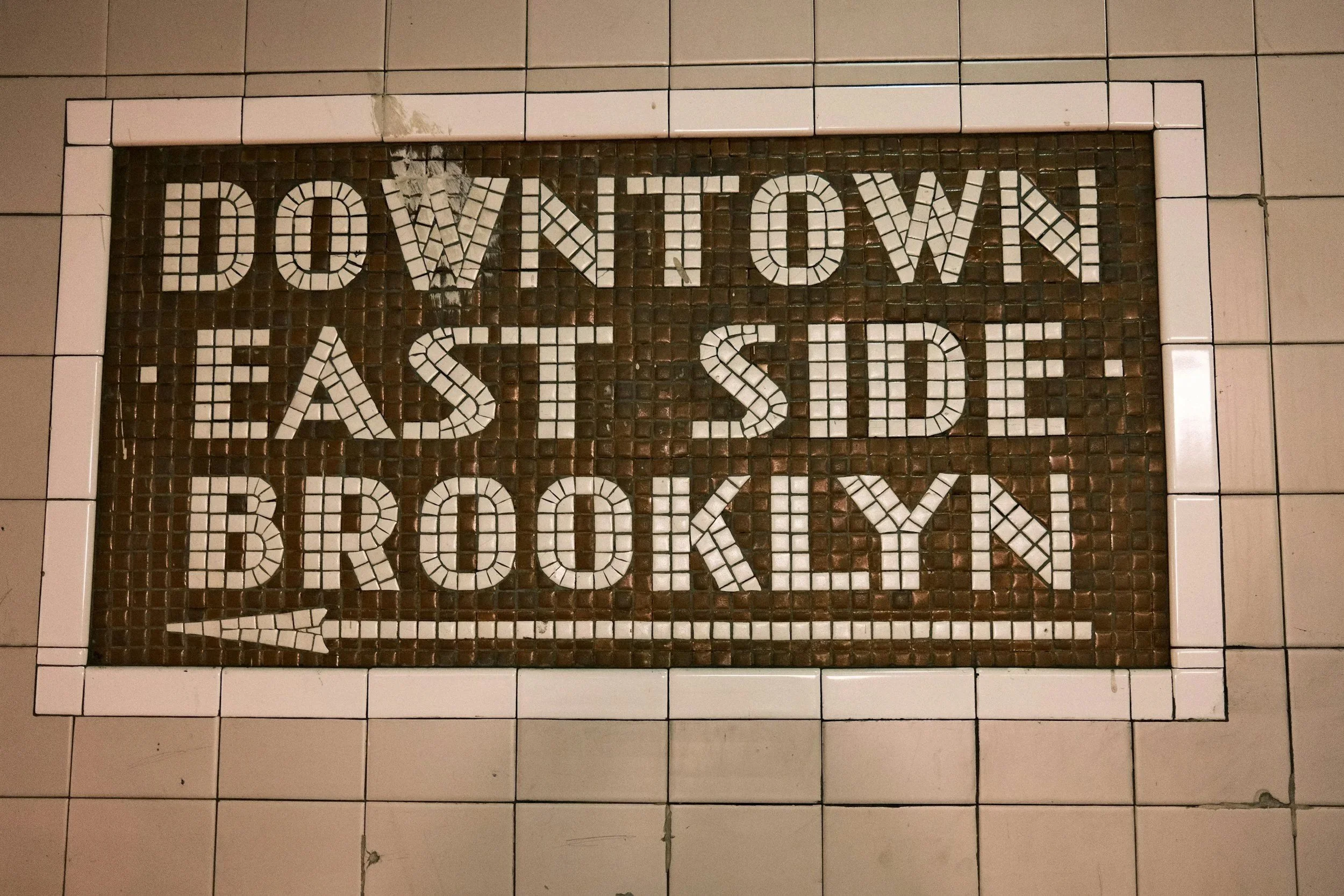 New York City subway sign in a Brooklyn station, representing access to therapy across Brooklyn and New York State.