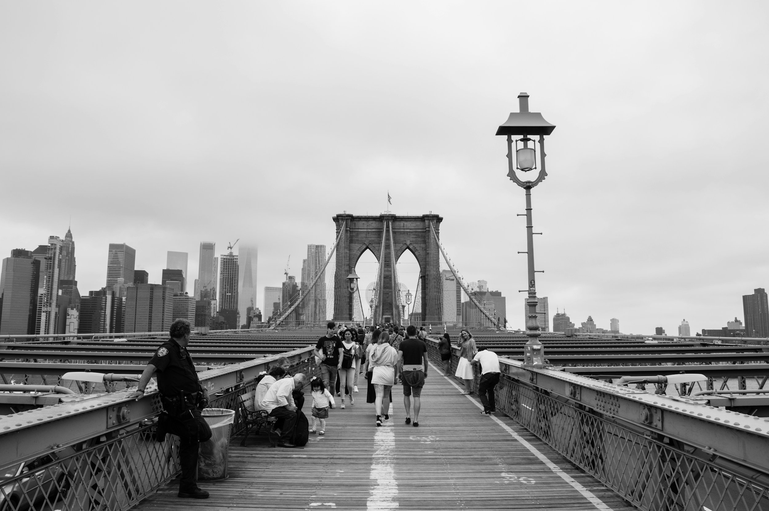 Two people walking together across the Brooklyn Bridge, ADHD and autism testing in Brooklyn