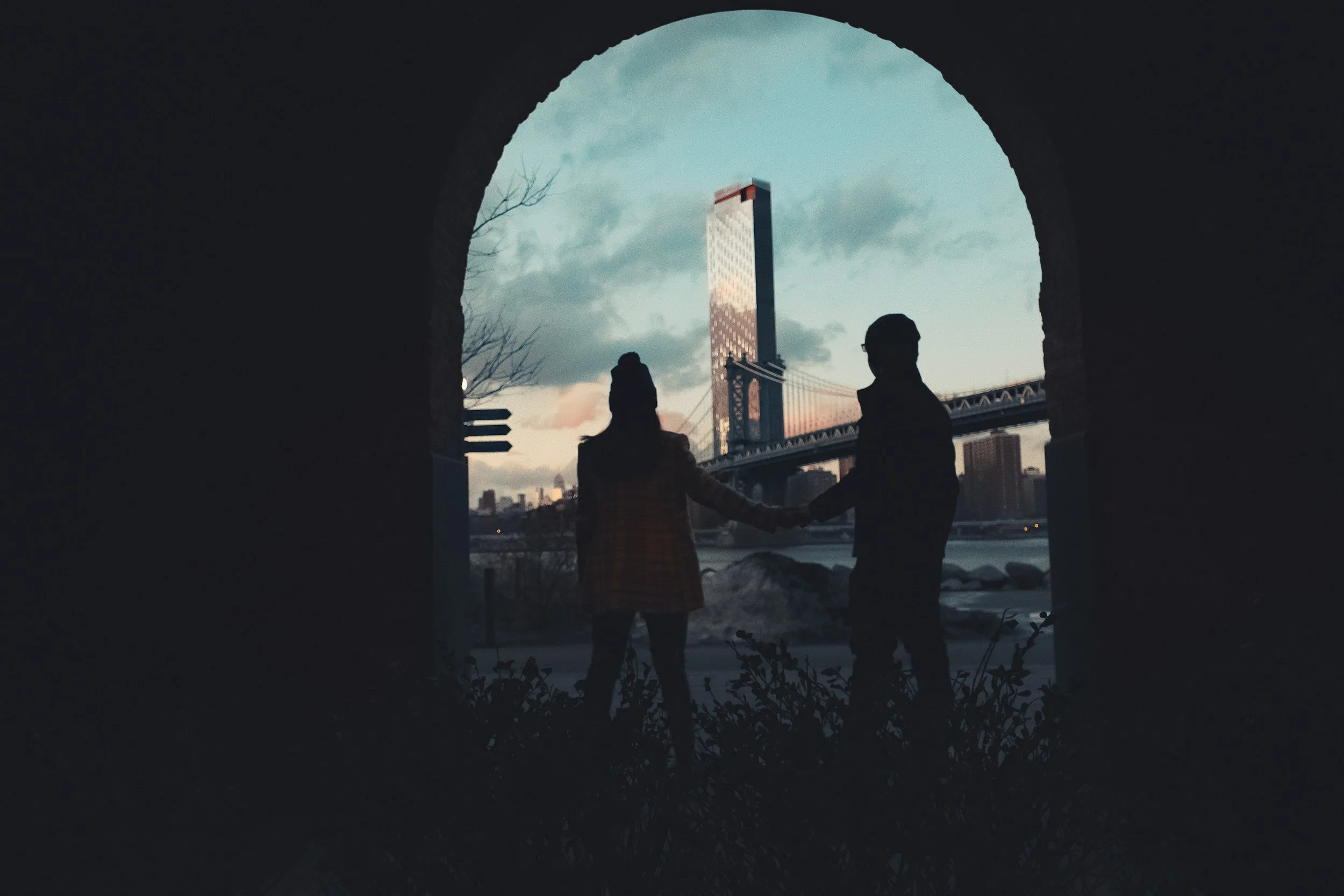 Two people looking out at the Brooklyn skyline together