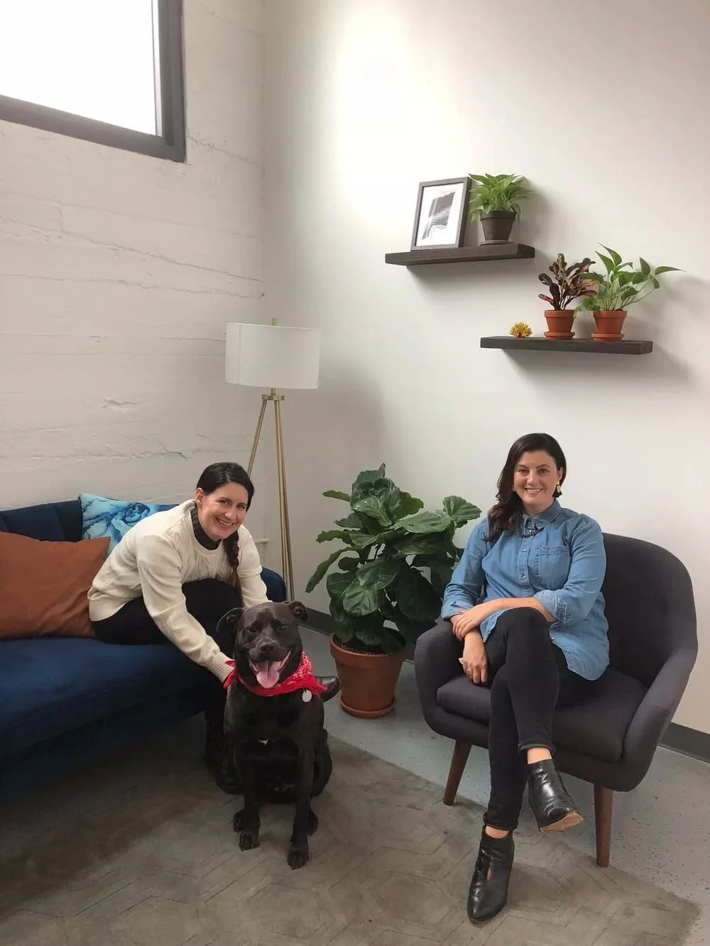 Dr. Philicia Rubin and Dr. Melissa Johnson, founders of Groundwork Therapy, with the practice therapy dog