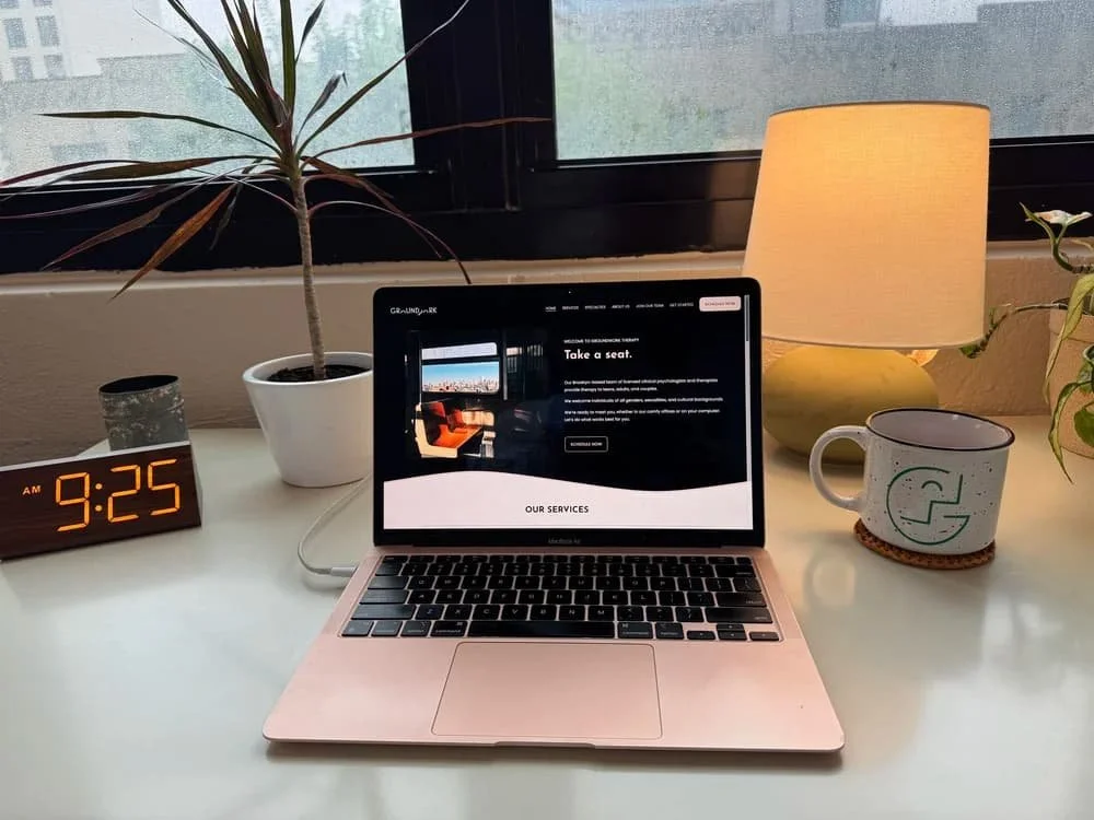Laptop displaying the Groundwork Therapy website for virtual therapy services in New York