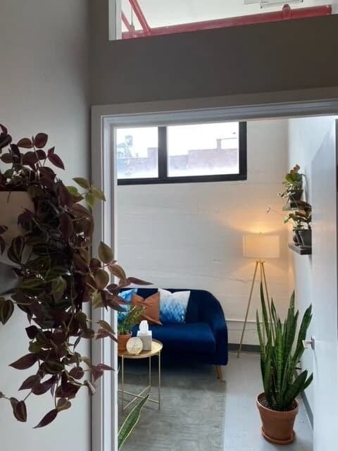 Blue couch in Groundwork Therapy office space