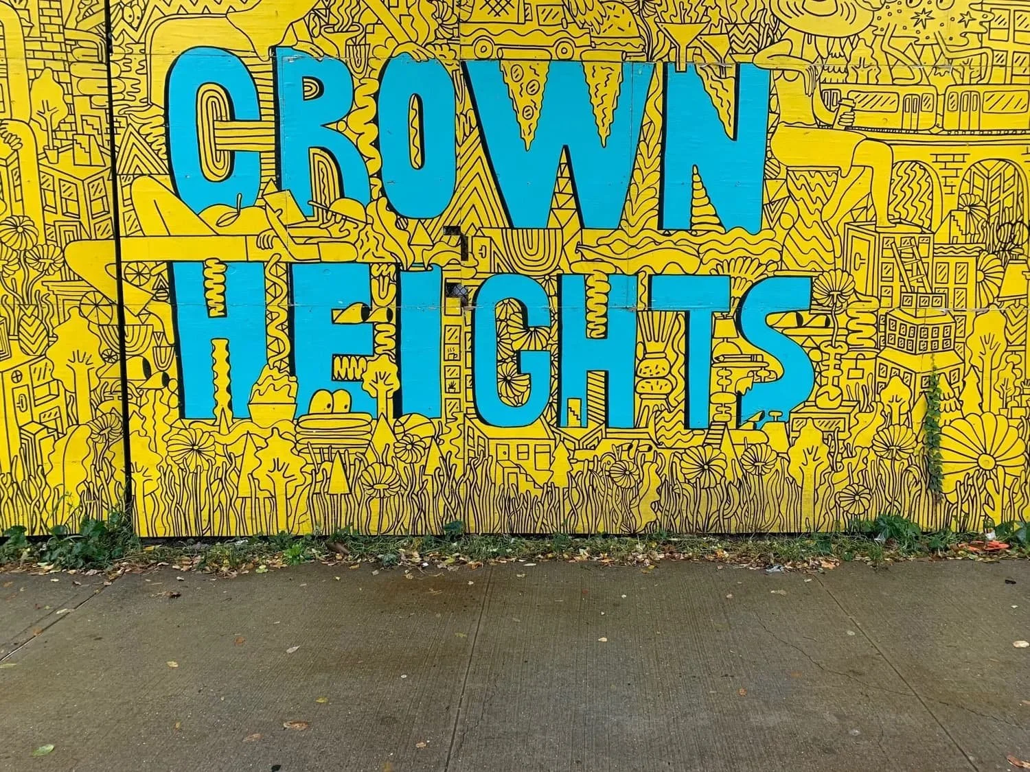 Graffiti wall featuring the words Crown Heights in Brooklyn