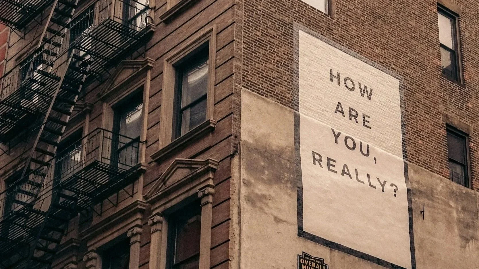 Building sign in NYC reading ‘how are you, really?’ used to represent teen therapy and emotional awareness