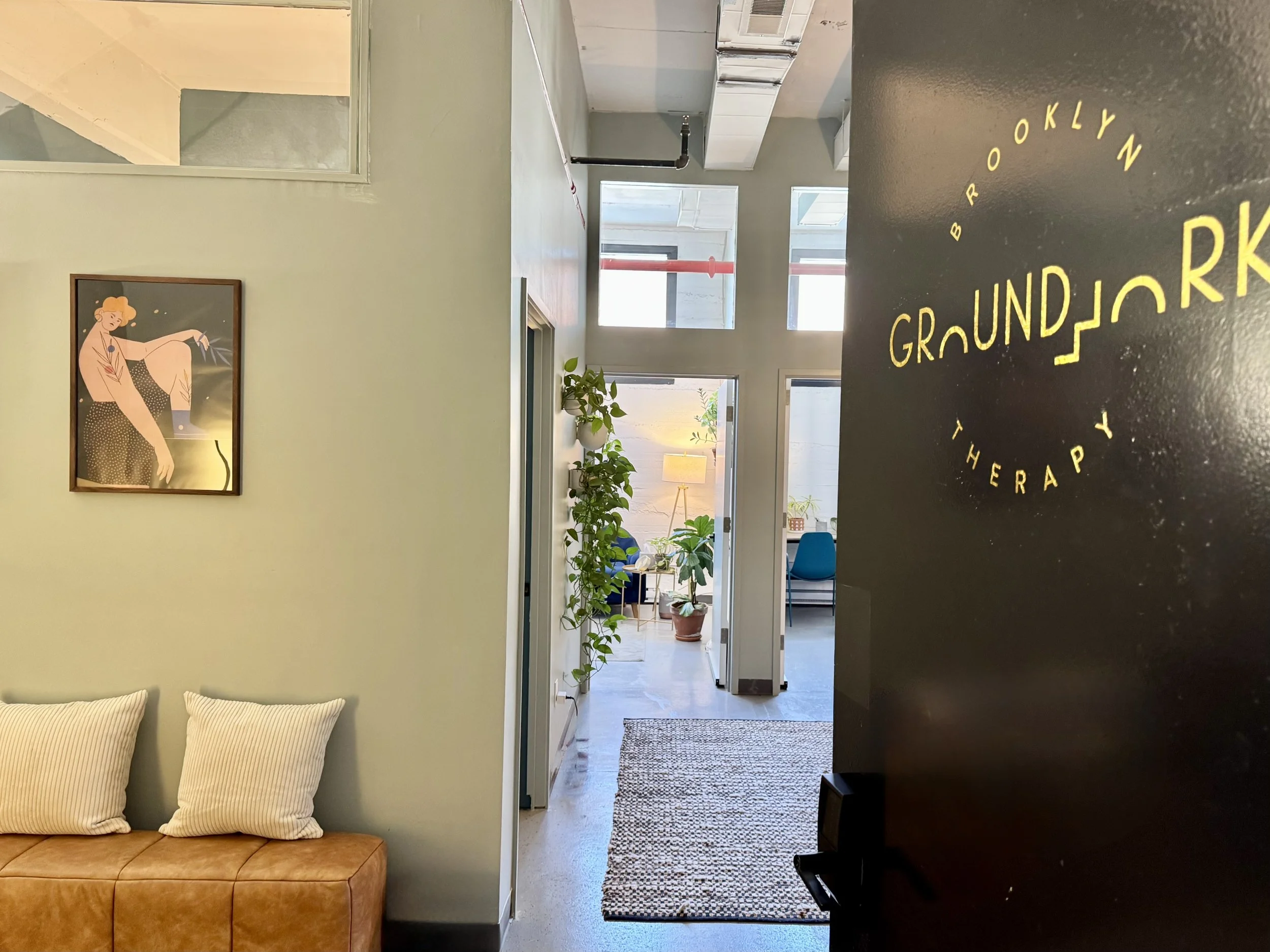 The entrance to a Brooklyn therapy office where groups are held with the door open revealing the waiting room.