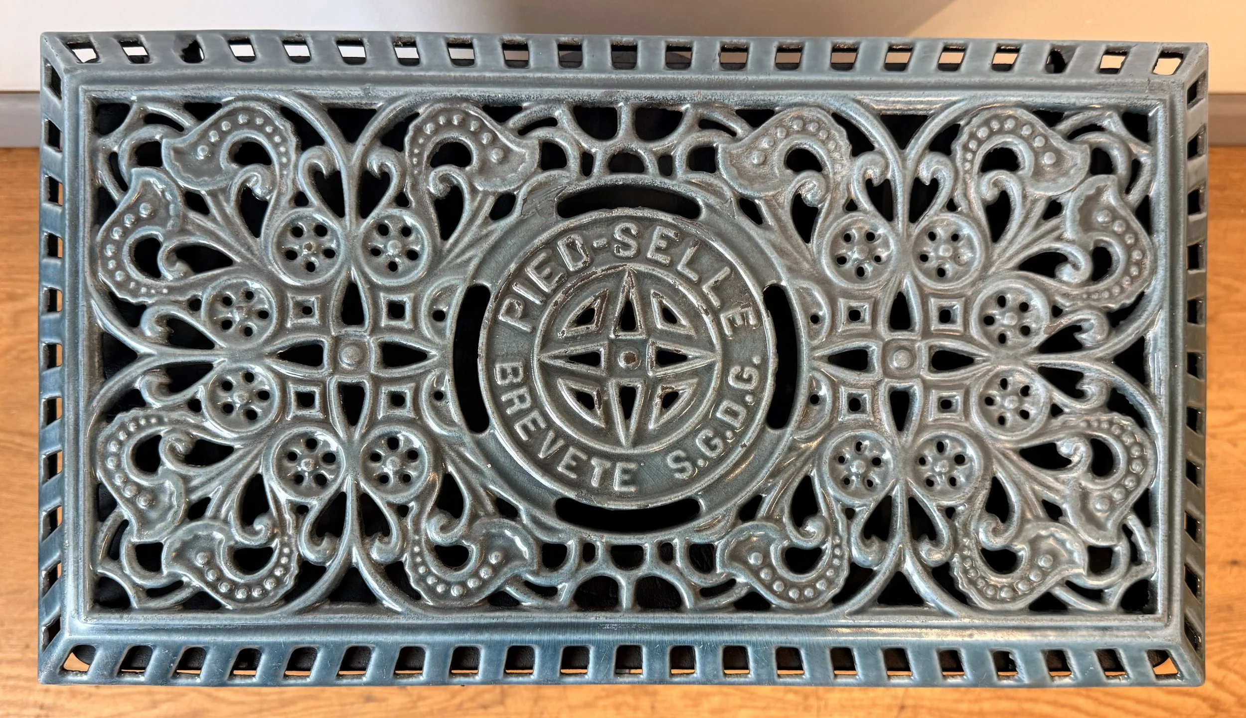 Lid showing intricate art nouveau design of French vintage fire
