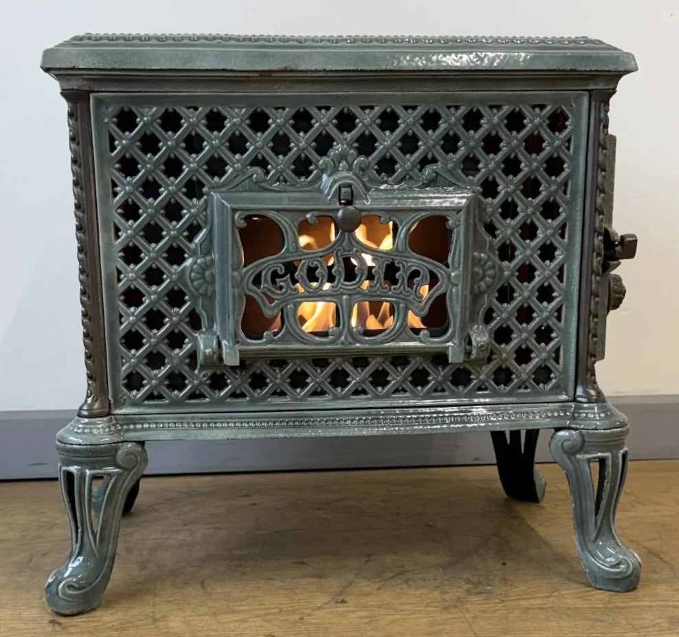 Front view of French Godin Chauffette antique stove