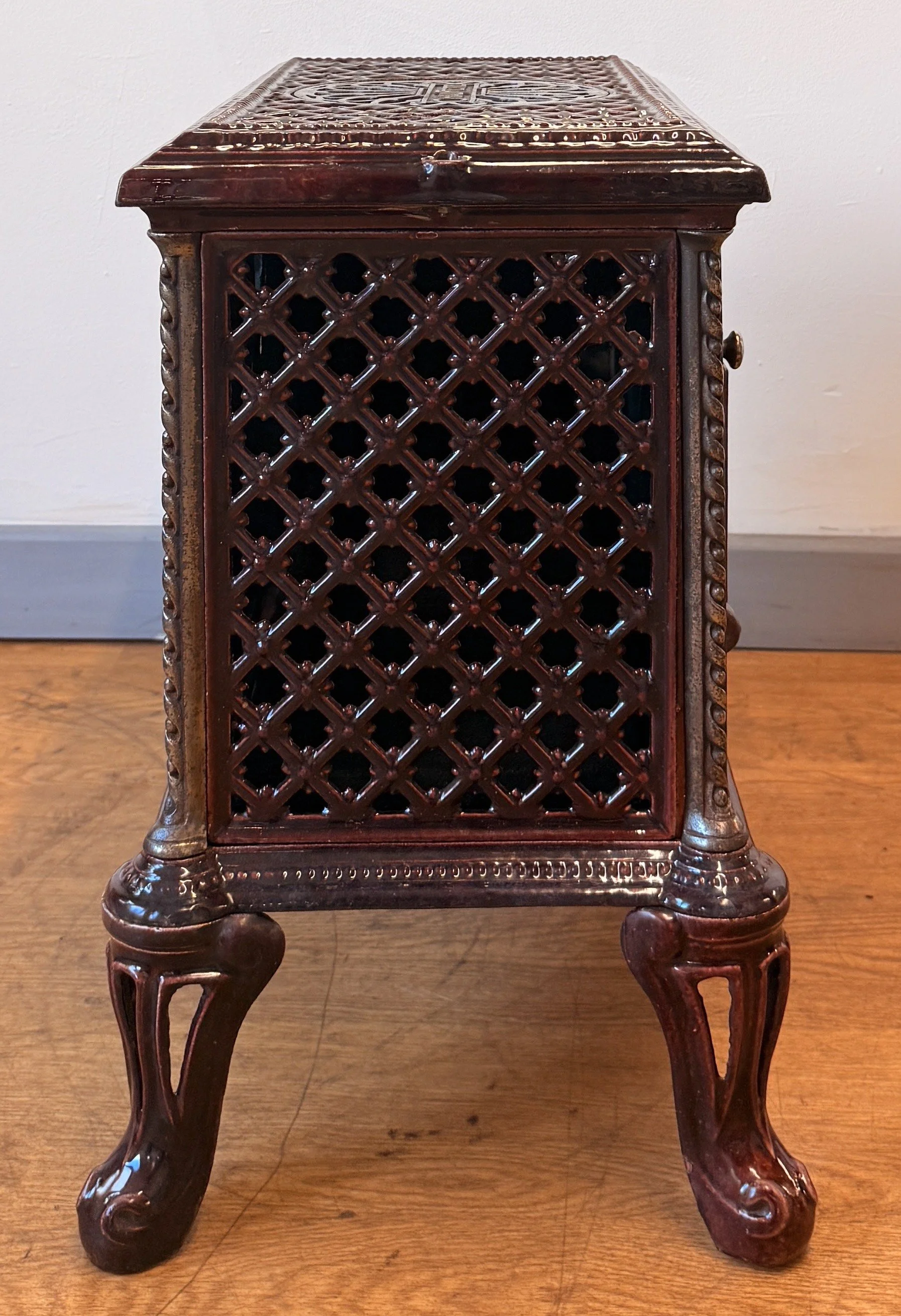 Side view of cast iron French stove