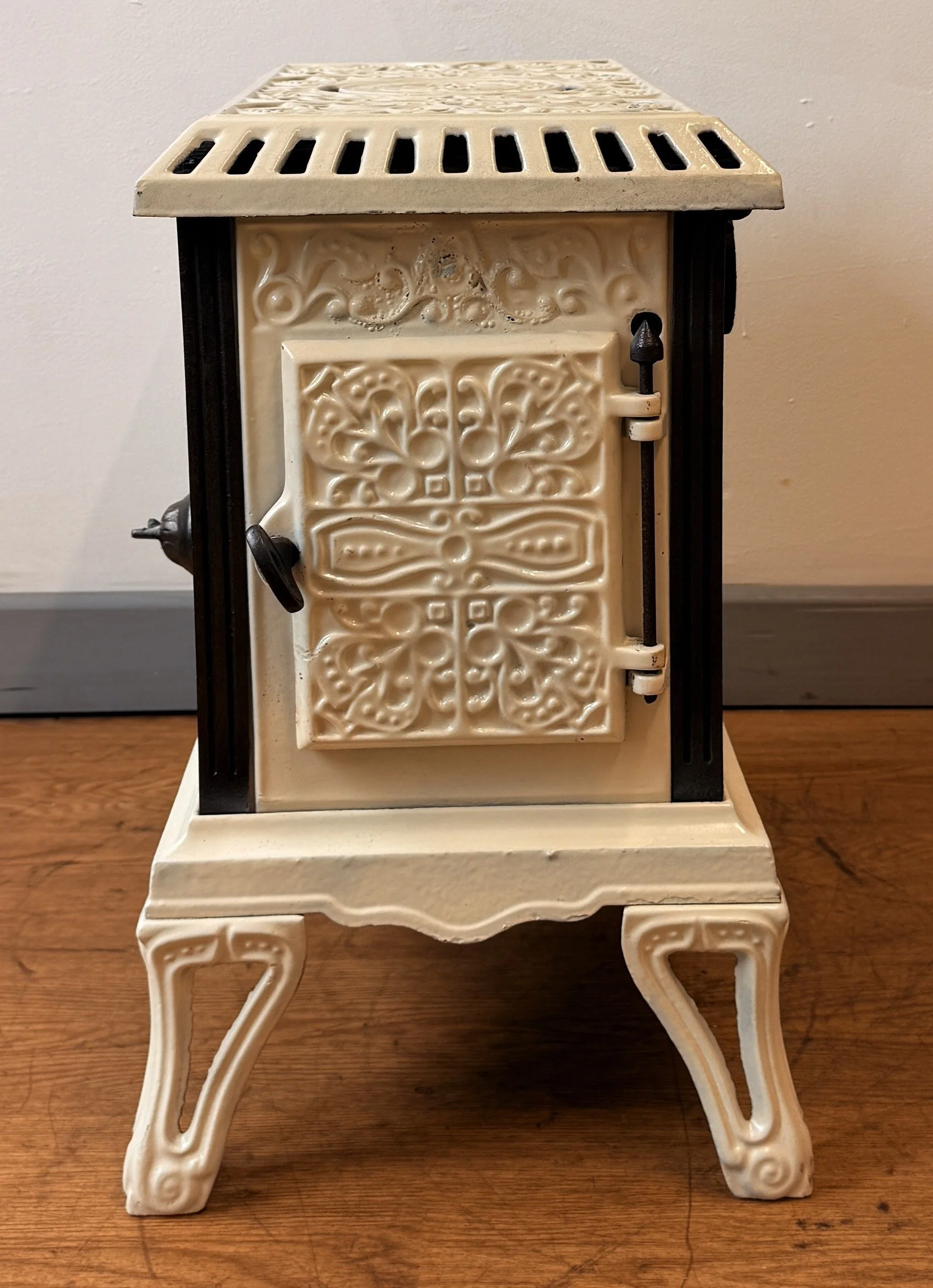 Side view with door of French cast iron stove