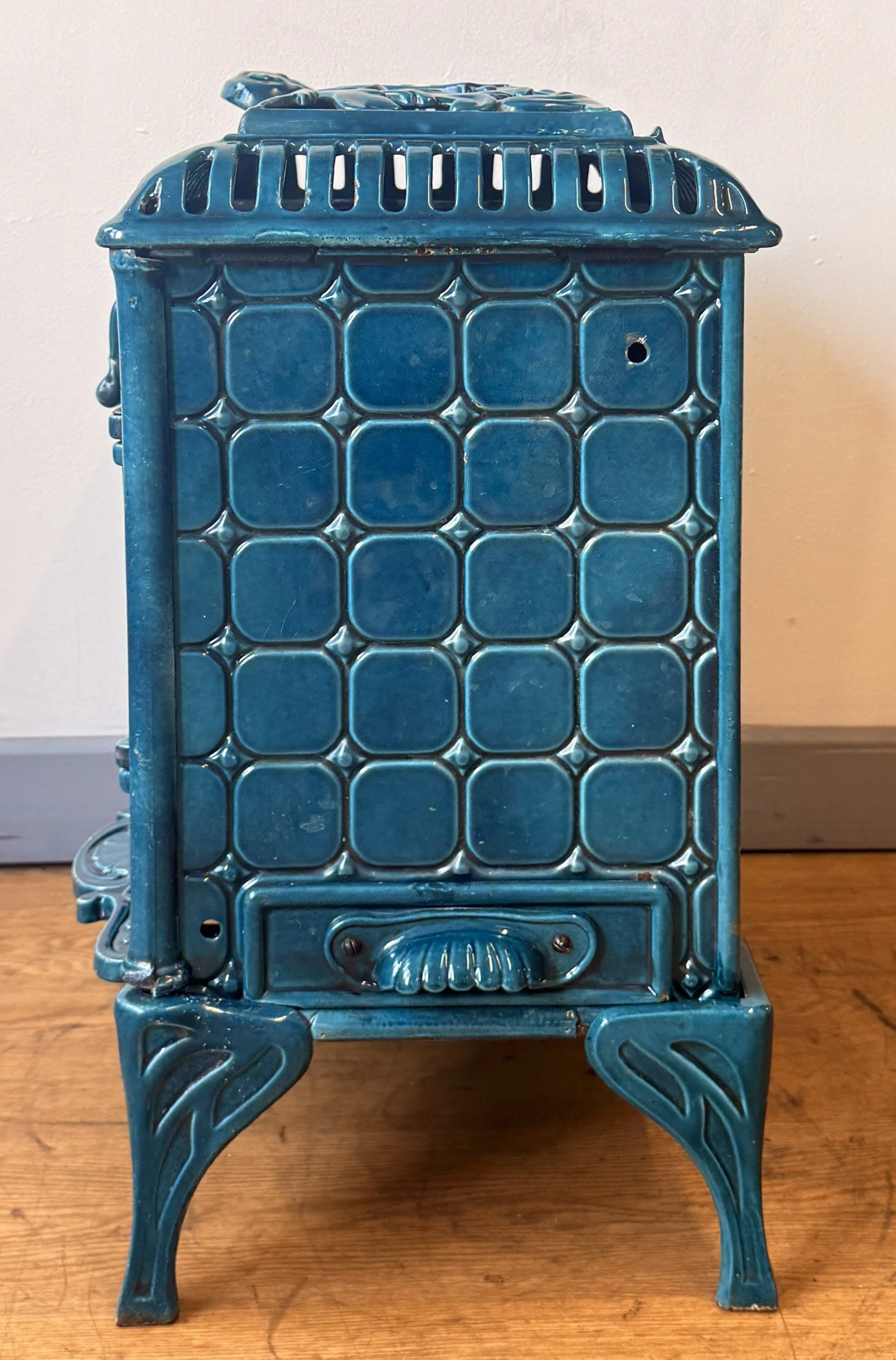Linear side view of a French antique stove