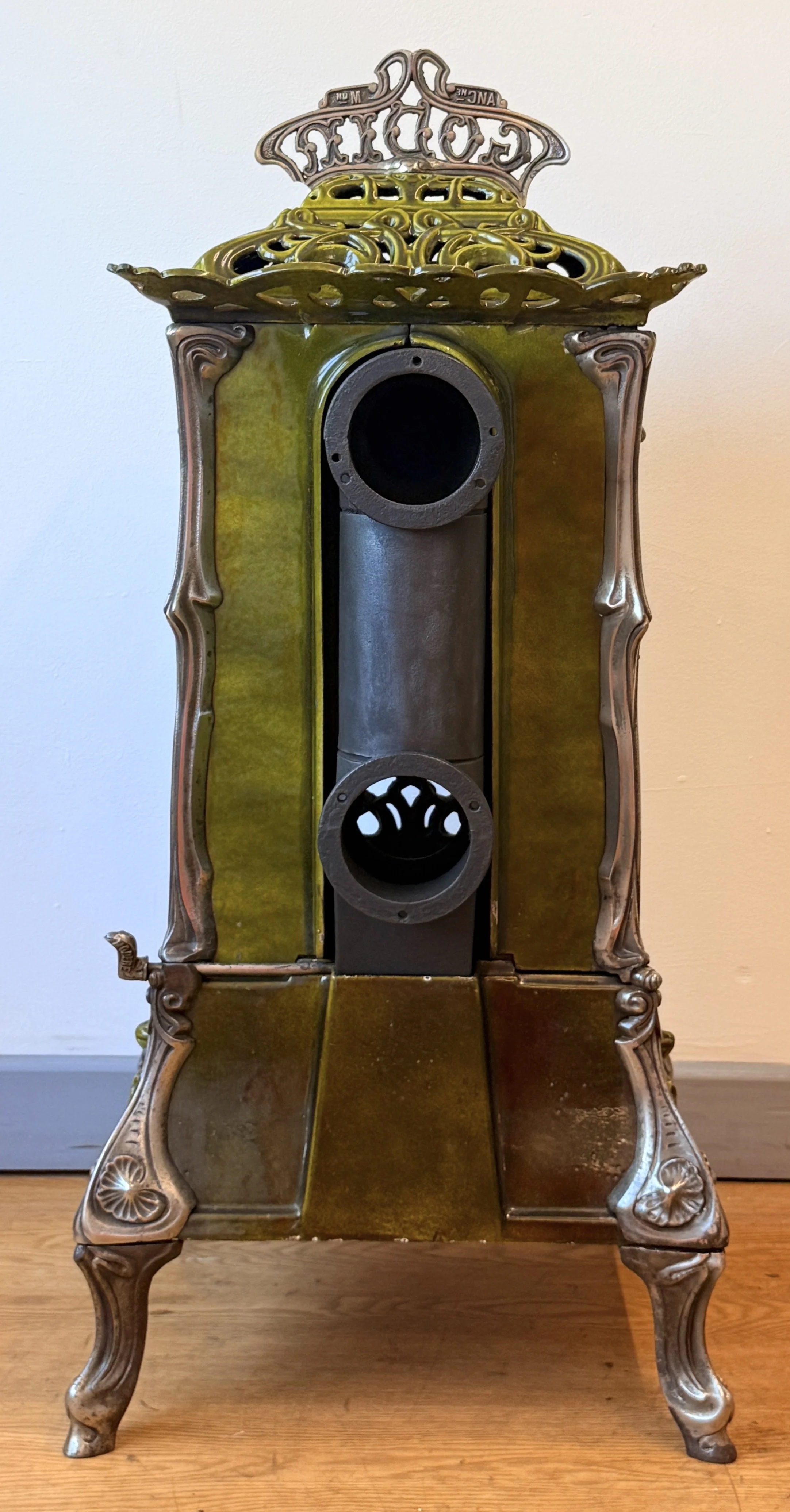 Rear view of flue on French cast iron stove