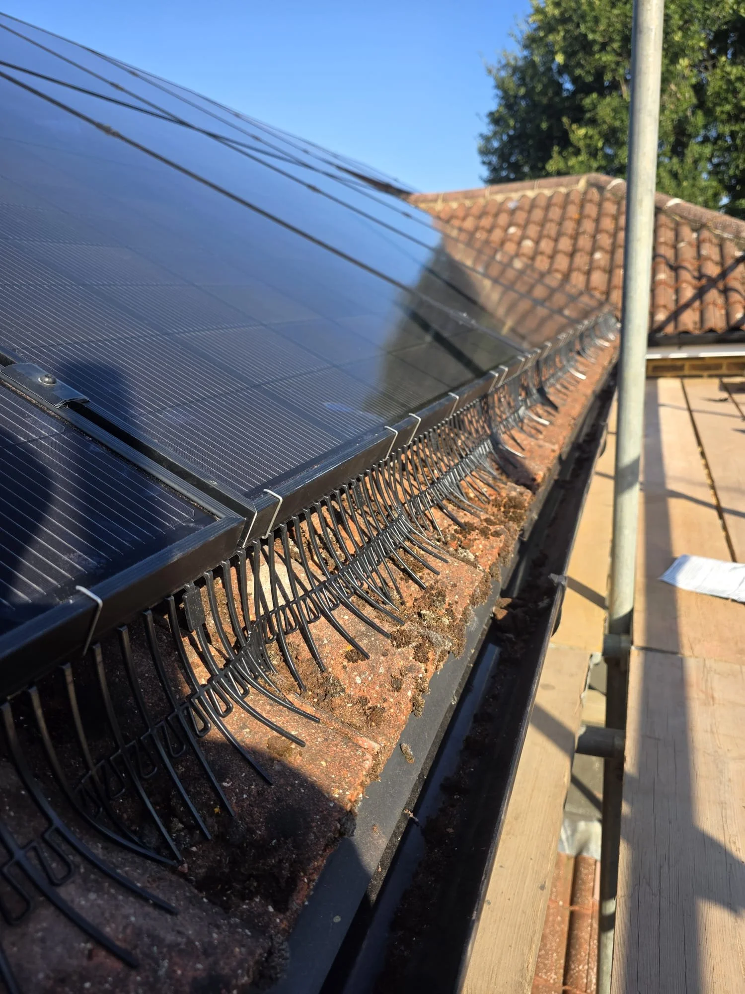 Photograph of solar panels installed on a house roof.