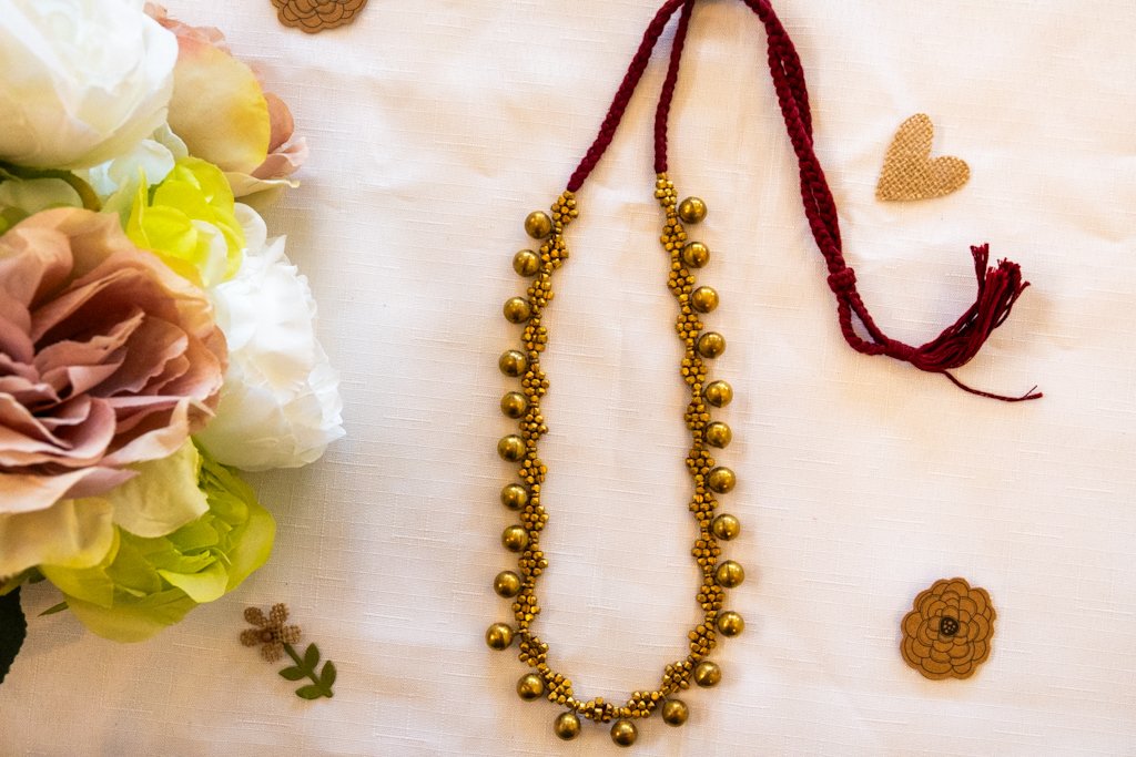 Handmade Dhokra Brass Ball Necklace – Woven Maroon Cord
