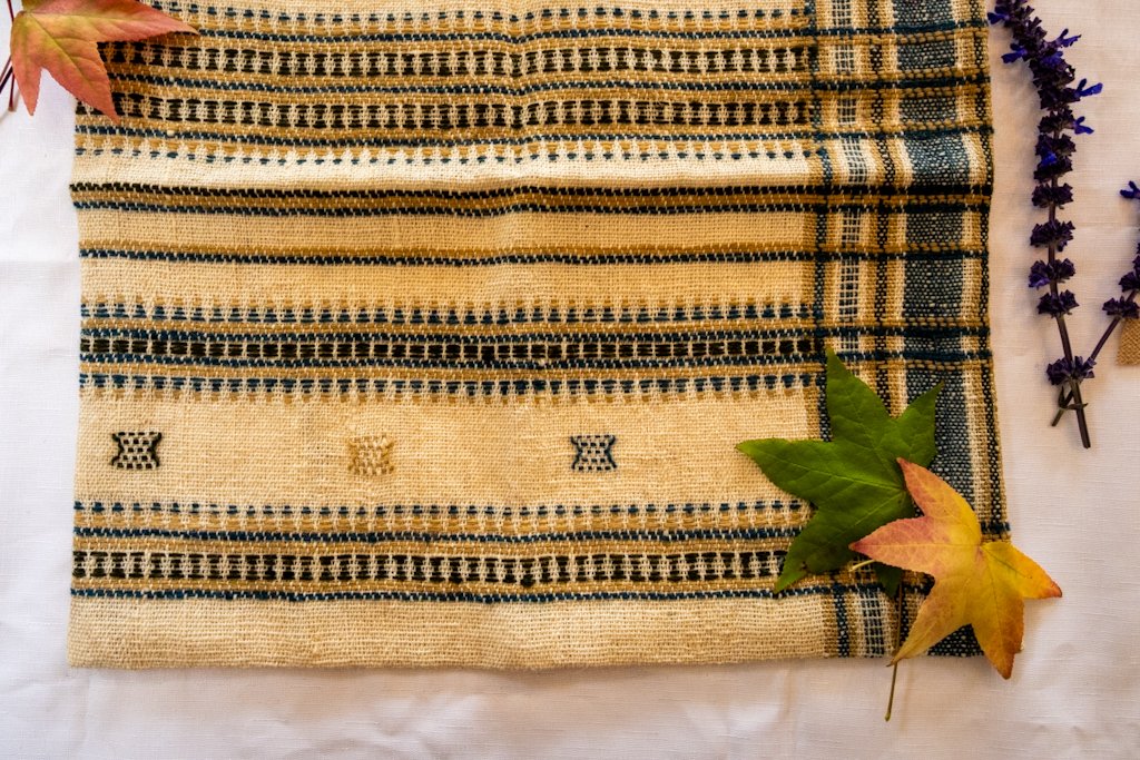 Handwoven Bhujodi Wool Cushion Cover – Natural Ivory with Indigo & Mustard Motifs
